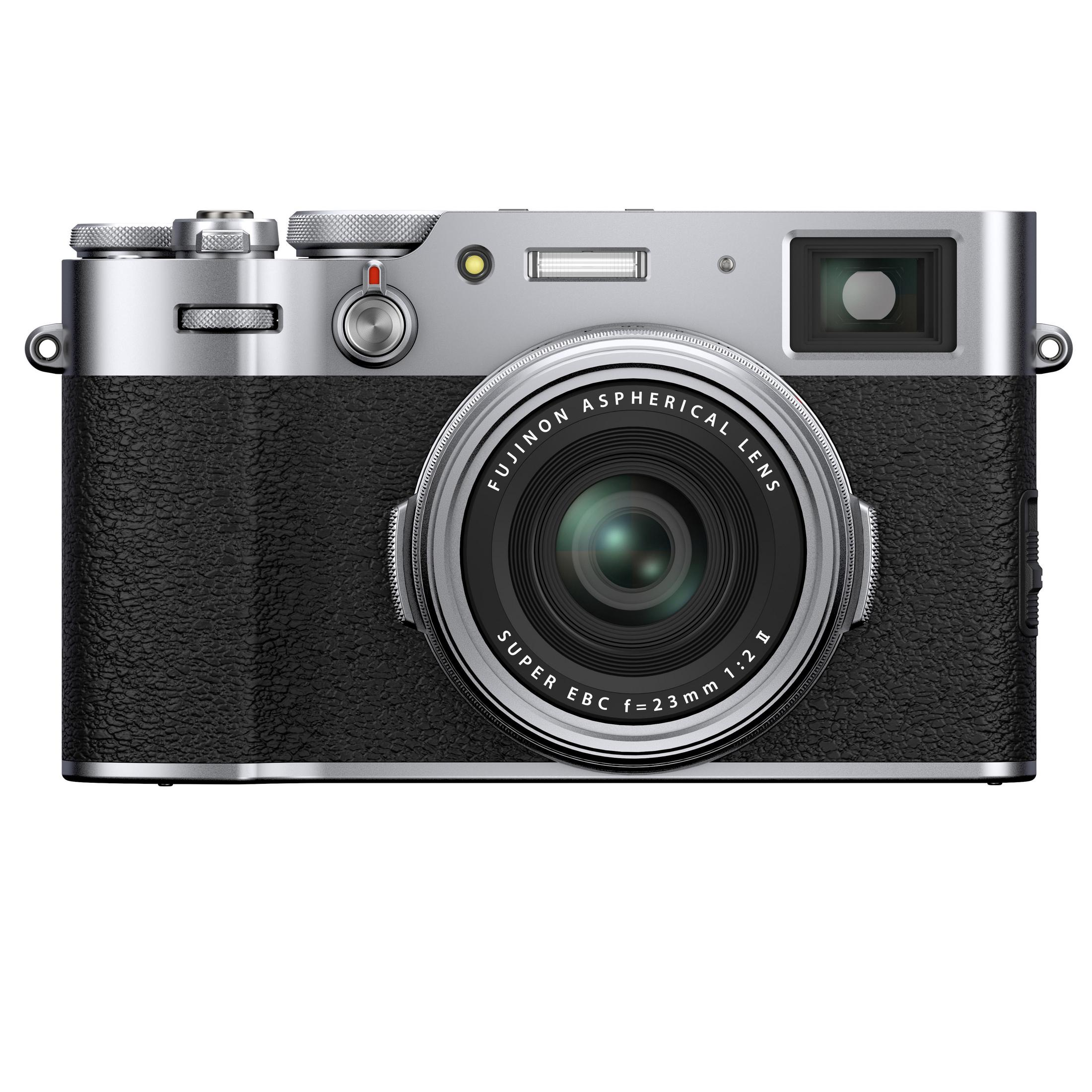 Silber-schwarze Fujifilm X100F Kamera mit Objektiv. Die Kamera steht auf einer weißen Oberfläche.