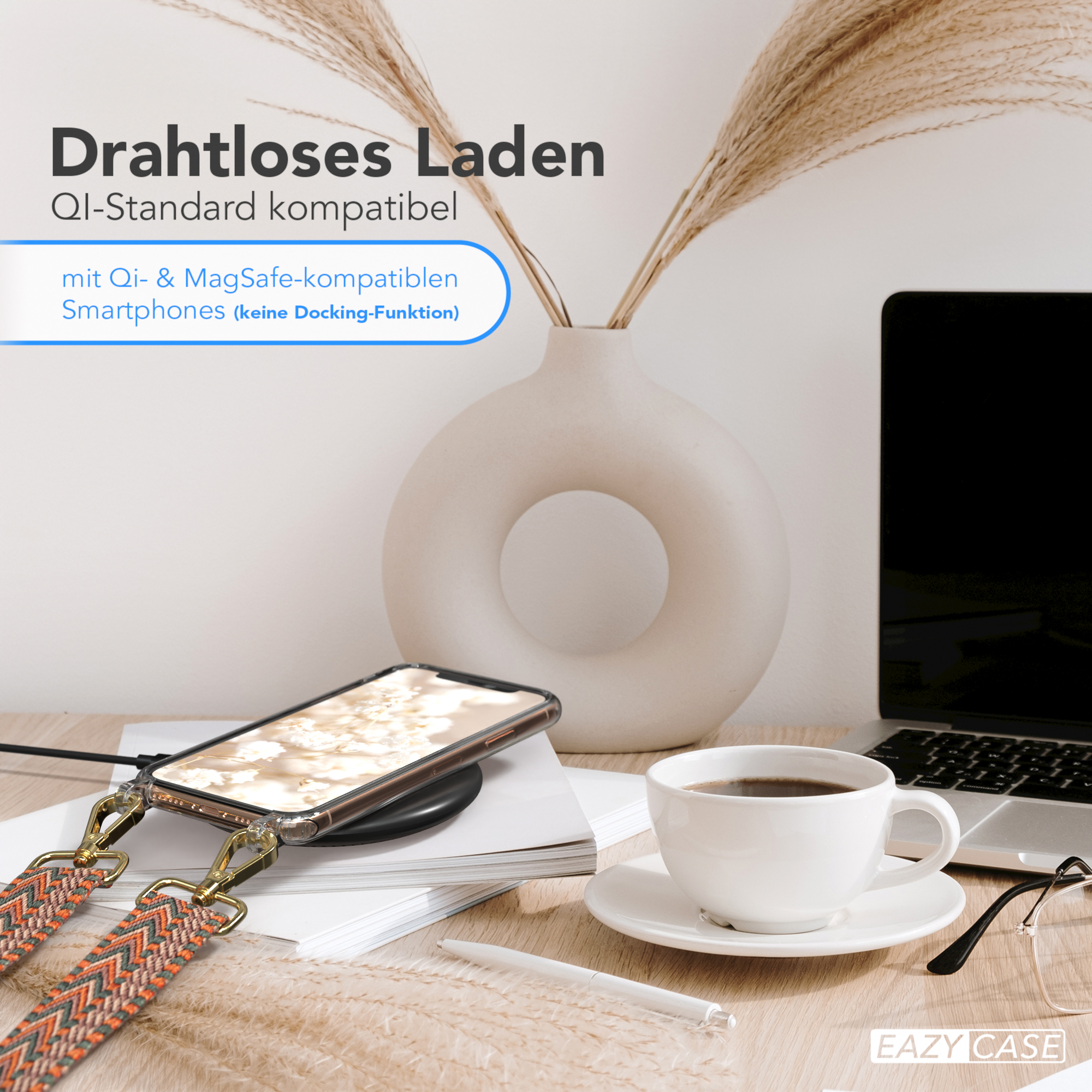 Ein Telefon liegt auf einem kabellosen Ladegerät auf einem Schreibtisch. Kaffee, Stift, Blumen. Text: 'Kabelloses Laden'.