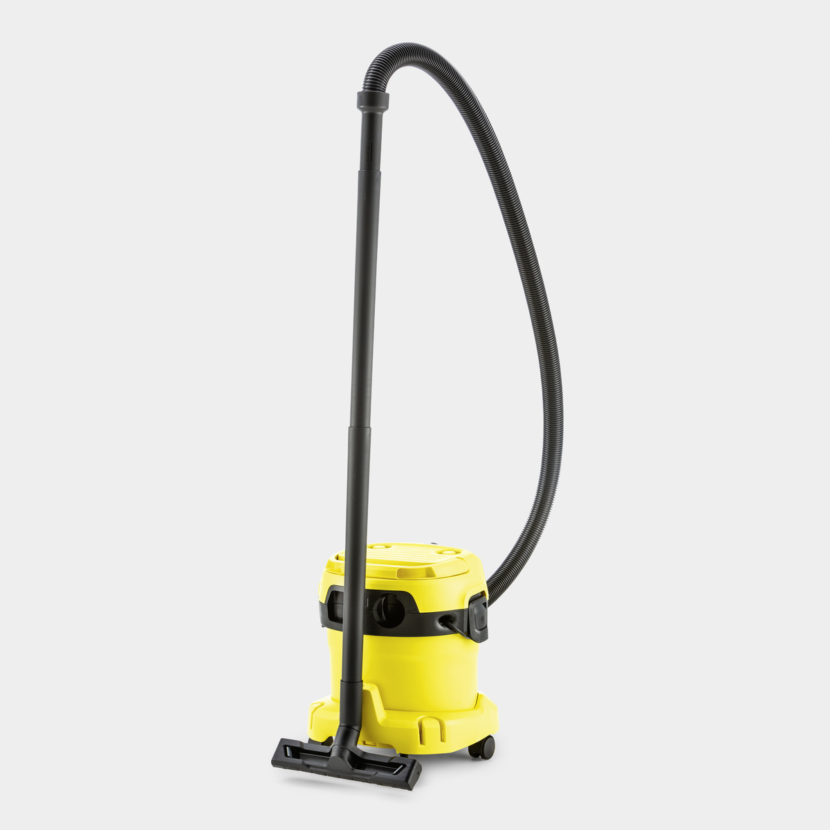 Aspirapolvere giallo con tubo e manico neri, su una superficie bianca.