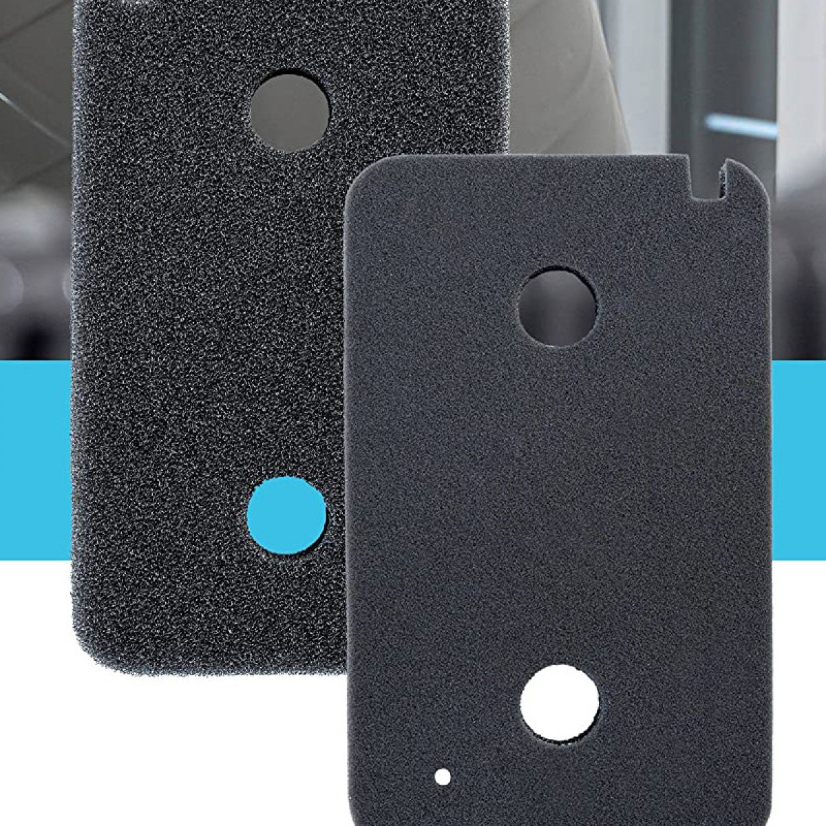 Two black foam pads with holes. One has a blue dot, the other has a white dot and a small hole.