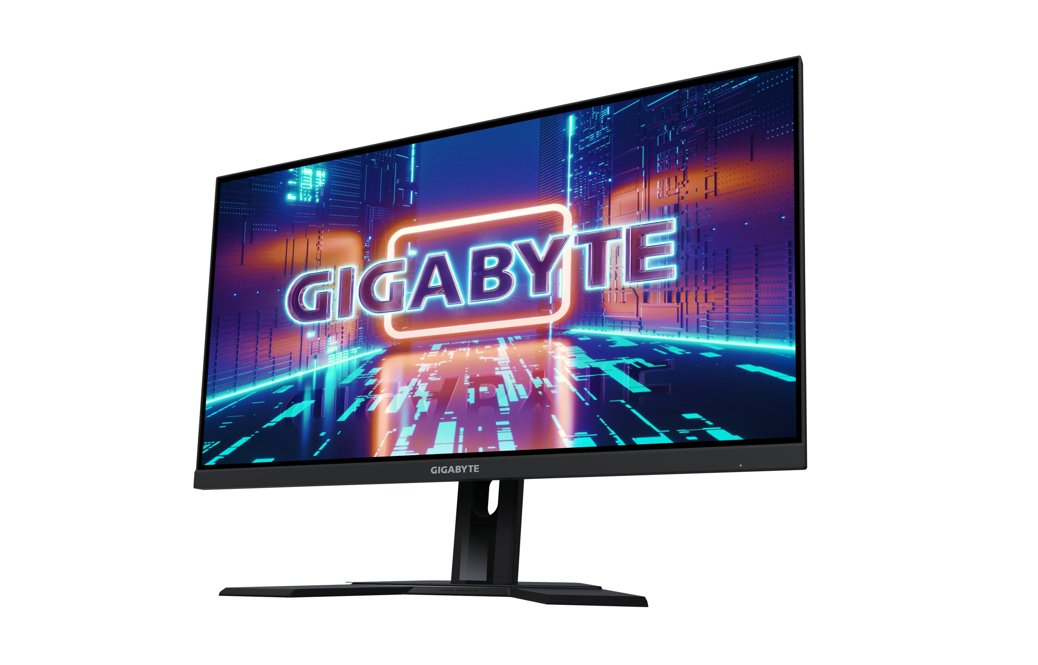 Monitor z logo GIGABYTE na ekranie. Ekran wyświetla futurystyczny design. Czarny stojak i ramka.