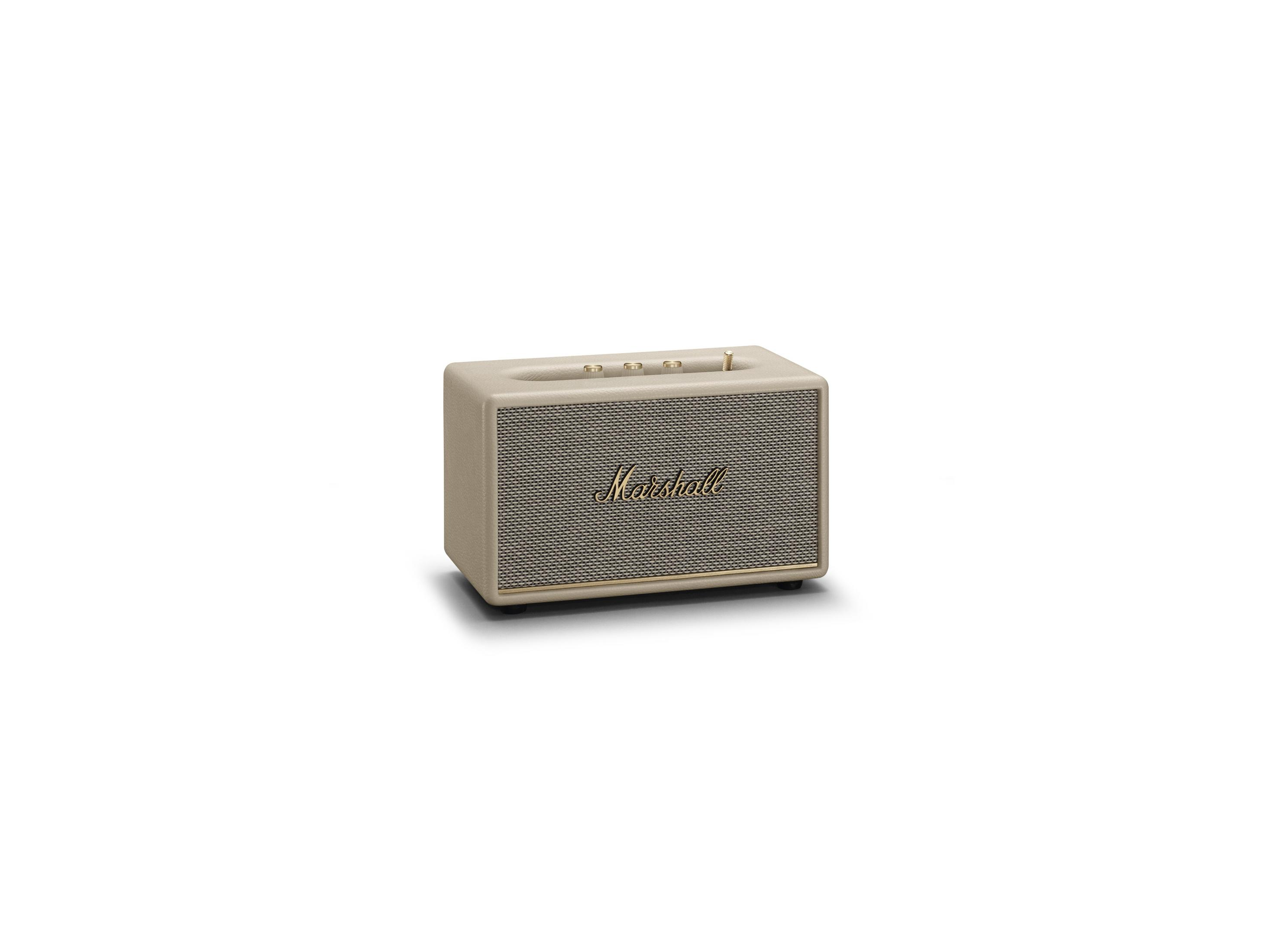 Ein beigefarbener Marshall-Lautsprecher. Er hat eine Gitterfront und ein goldenes Marshall-Logo.