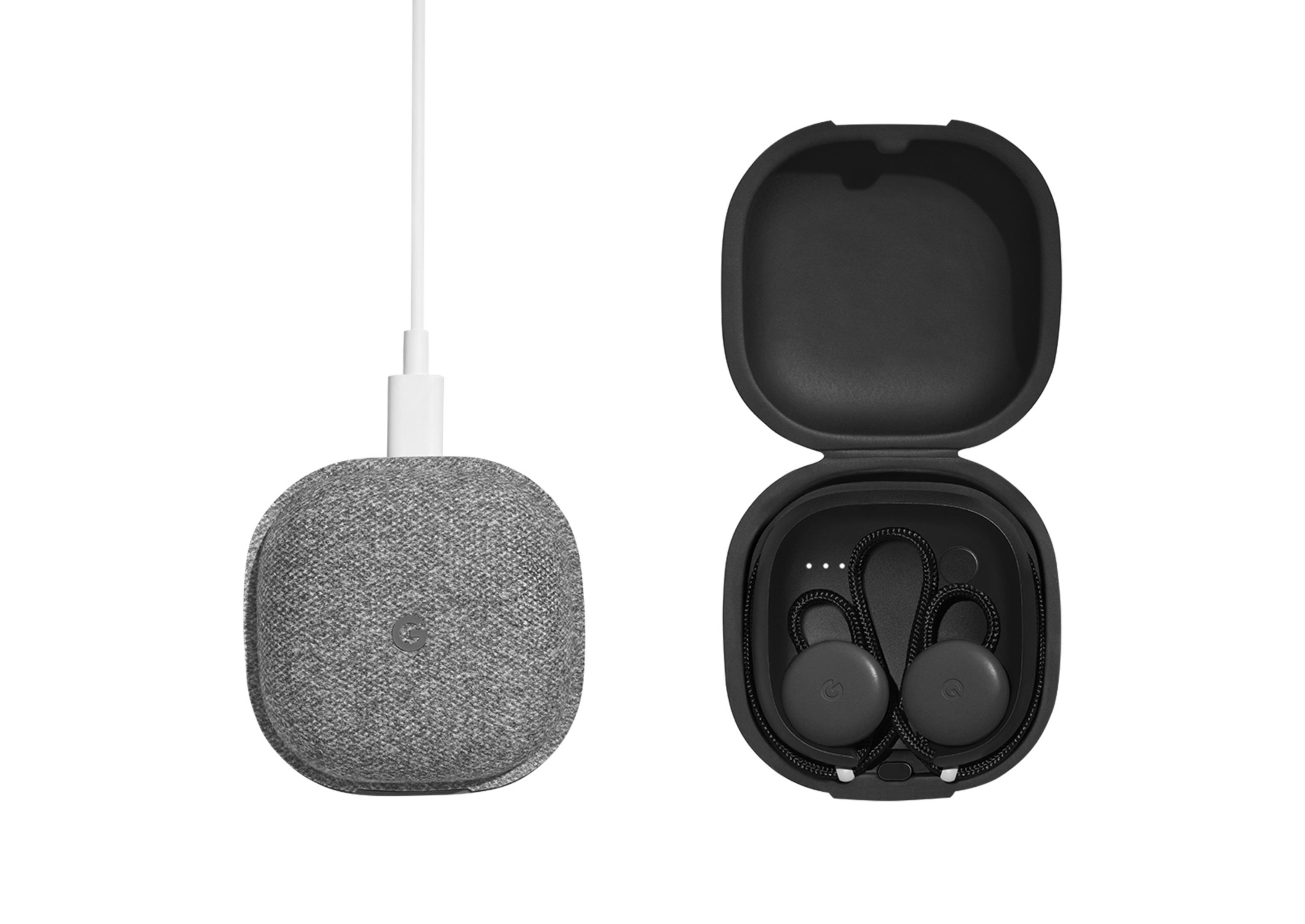 Dos auriculares grises de Google y un estuche de carga gris sobre fondo blanco.