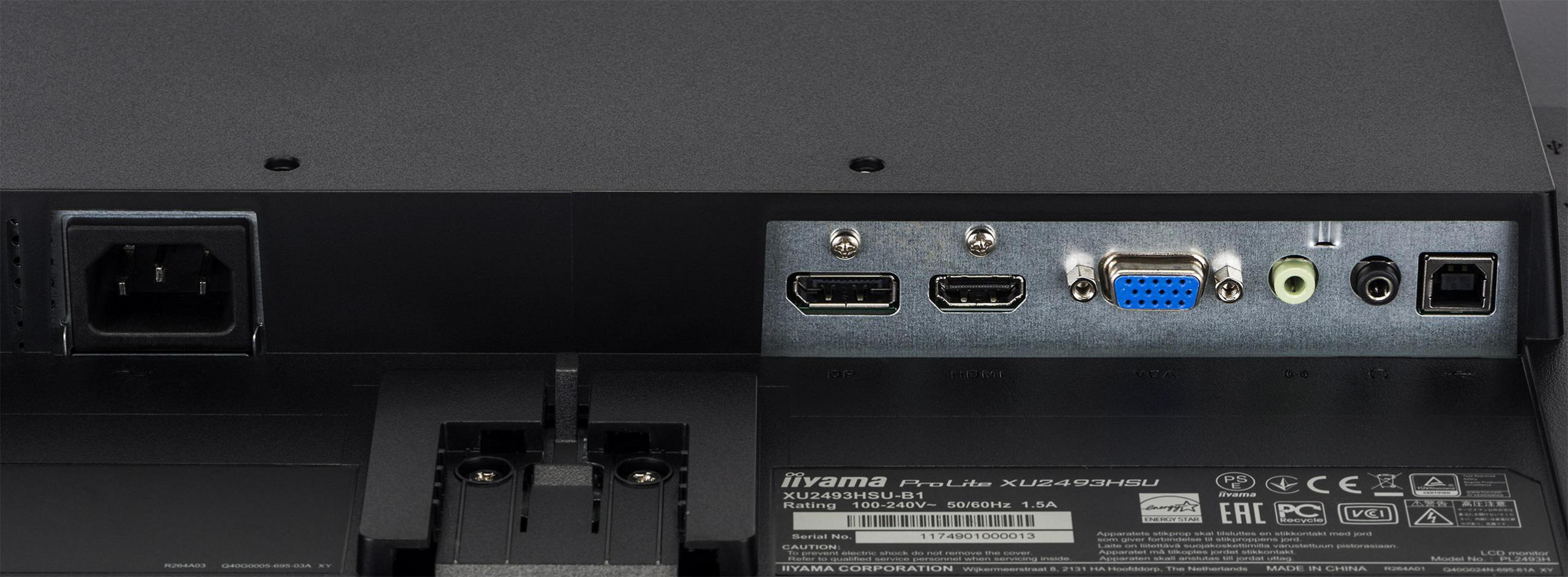 Rückseite eines schwarzen Monitors mit verschiedenen Anschlüssen. Strom-, HDMI-, USB- und Audioanschlüsse sichtbar.