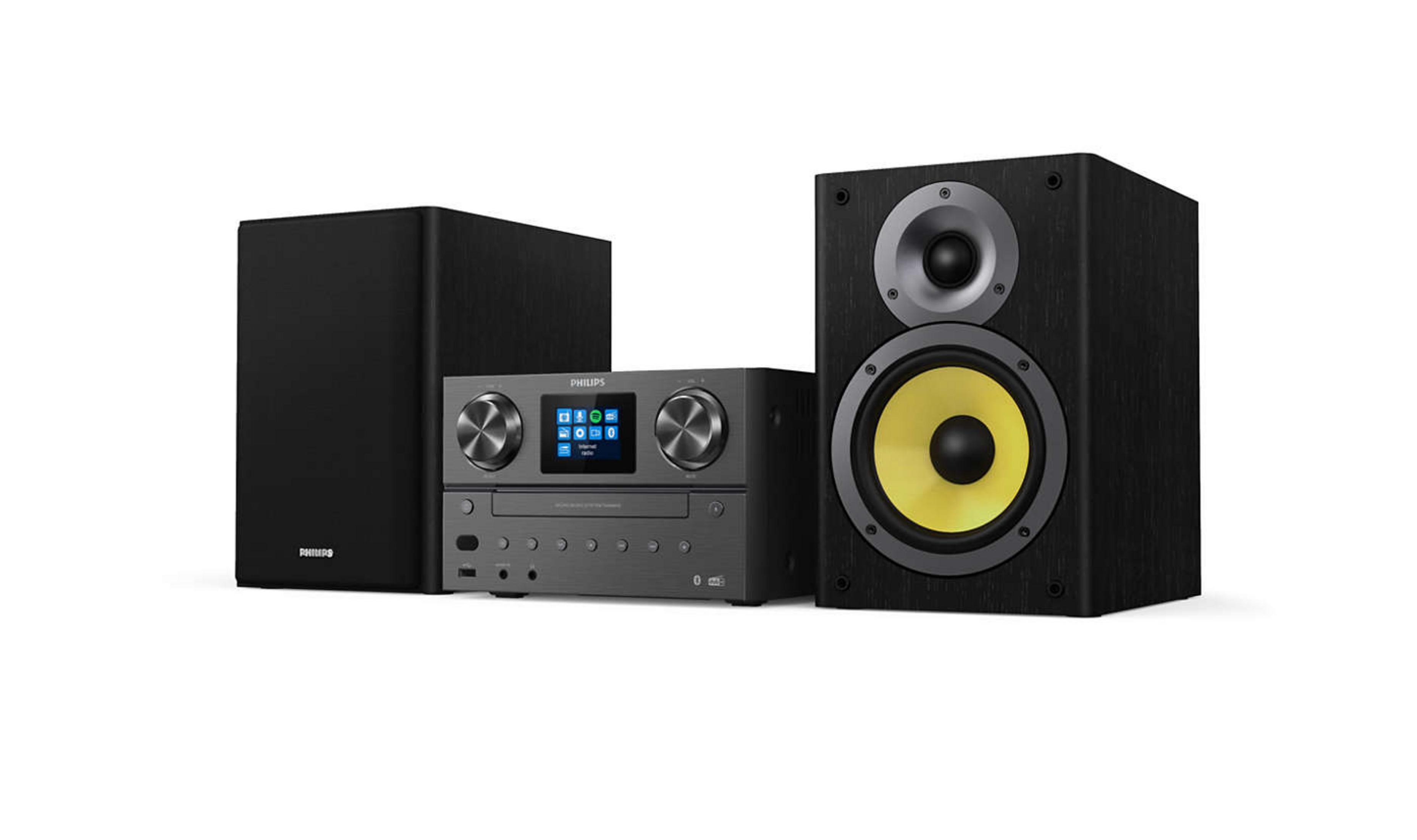 System stereo z głośnikiem, odbiornikiem i subwooferem. Wszystko czarne na białym tle.