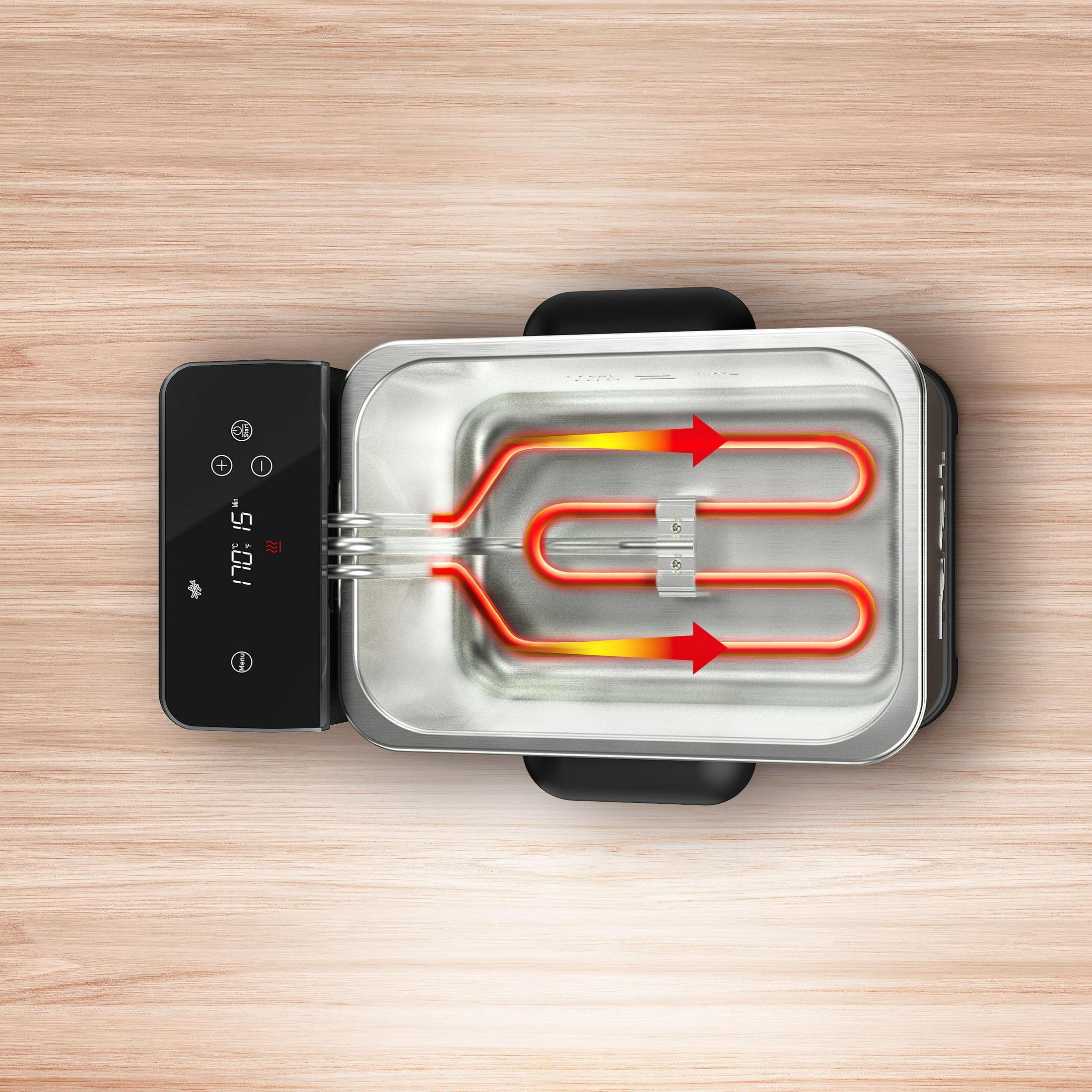 Widok z góry na urządzenie do gotowania. Element grzejny jest czerwony. Panel sterowania jest z boku.