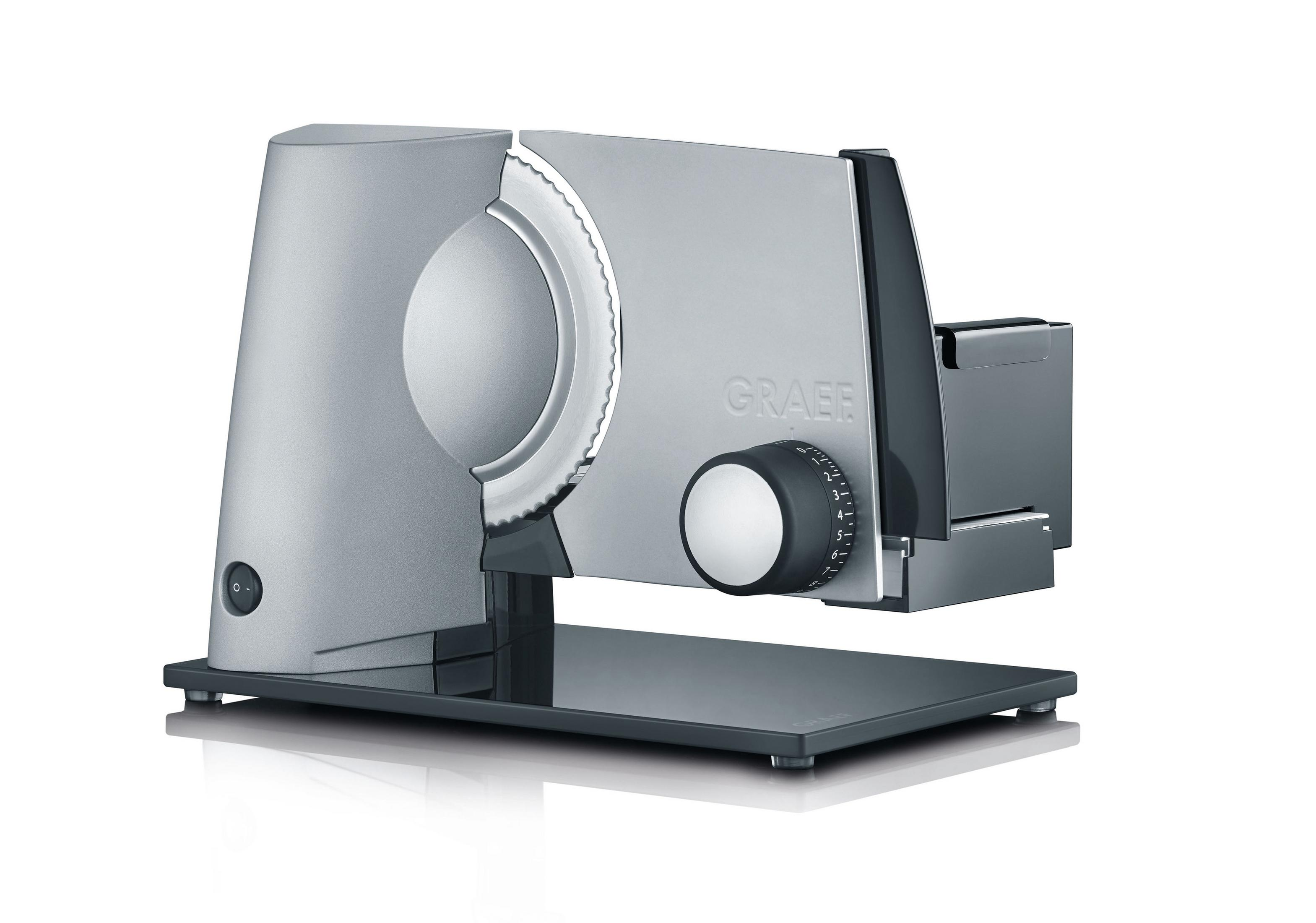 Srebrna krajalnica Graef, odsłonięte ostrze, na czarnej podstawie, białe tło.