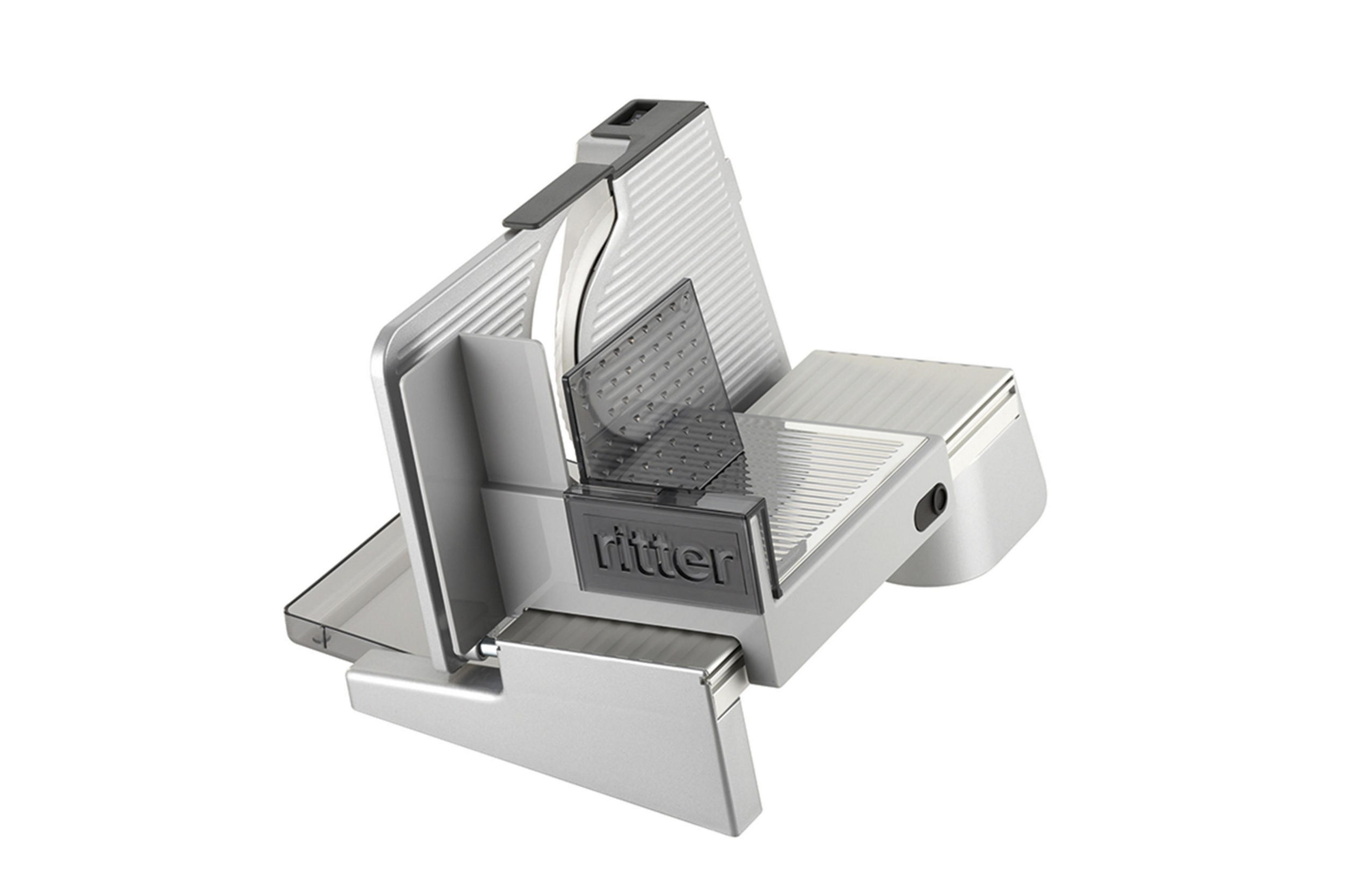 Silberne Fleischschneidemaschine mit Klinge und Schneidebrett.