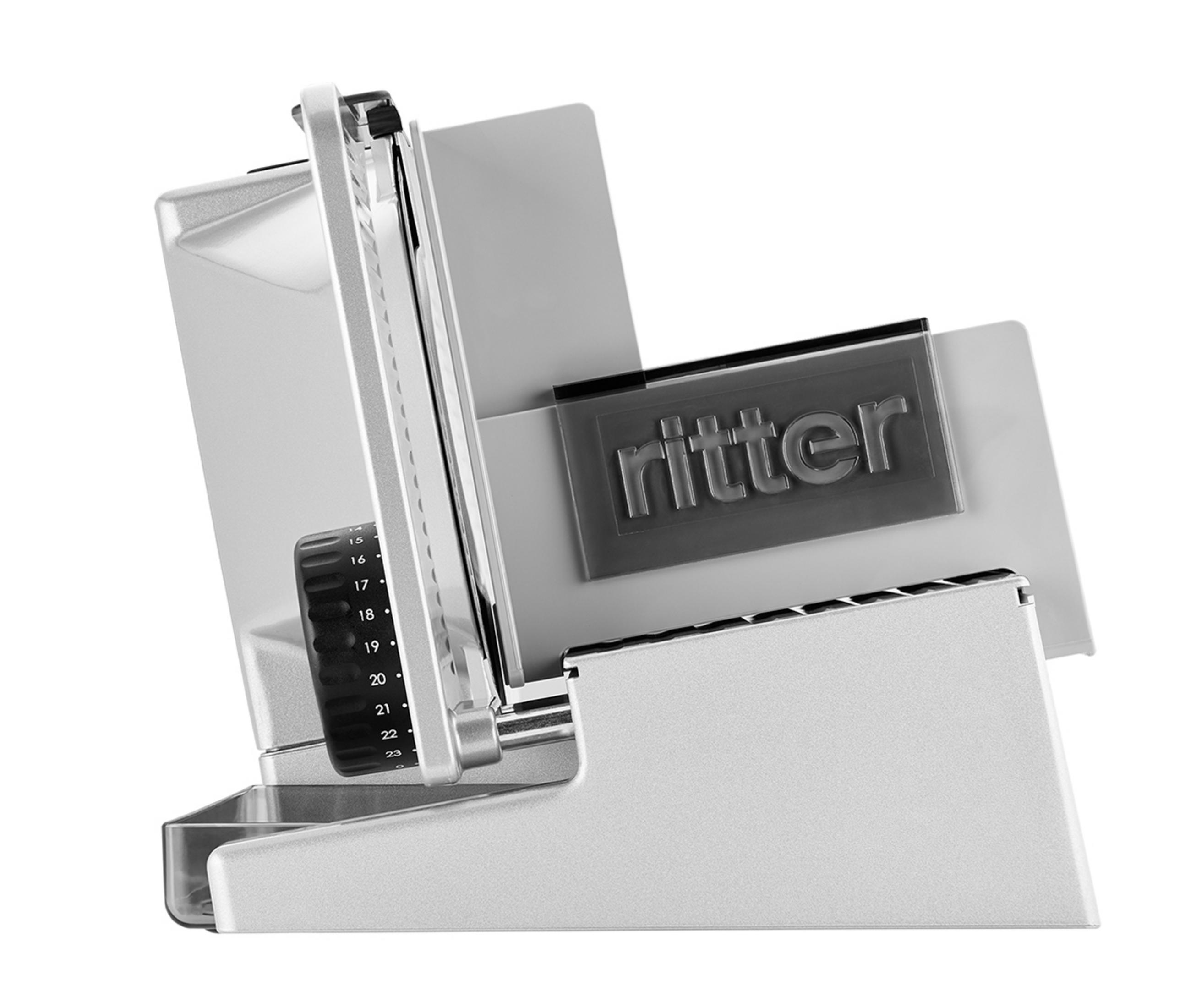 Srebrna krajalnica Ritter z regulowanymi ustawieniami, na białym tle.