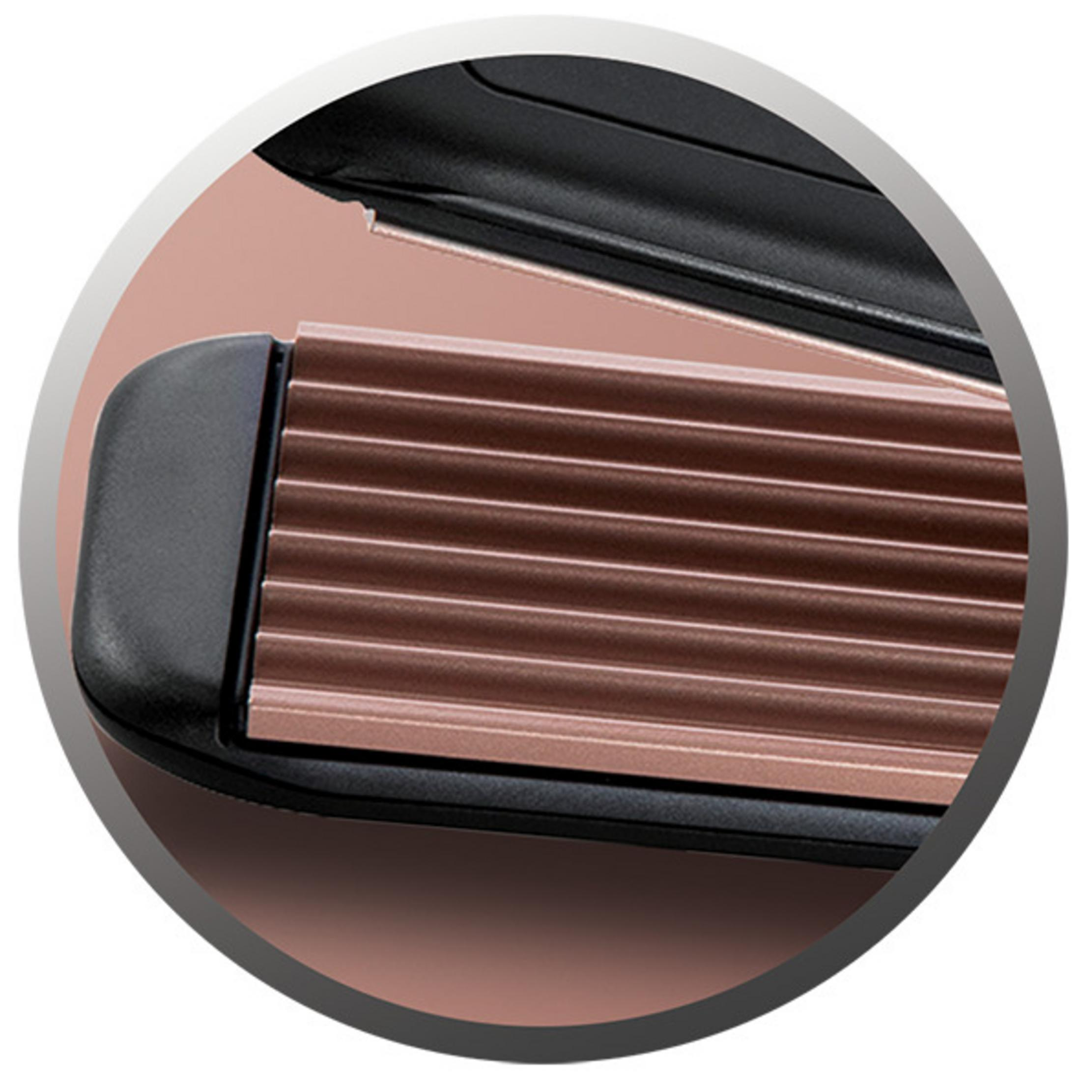 Close up of a hair crimper. The crimper is black and rose gold.