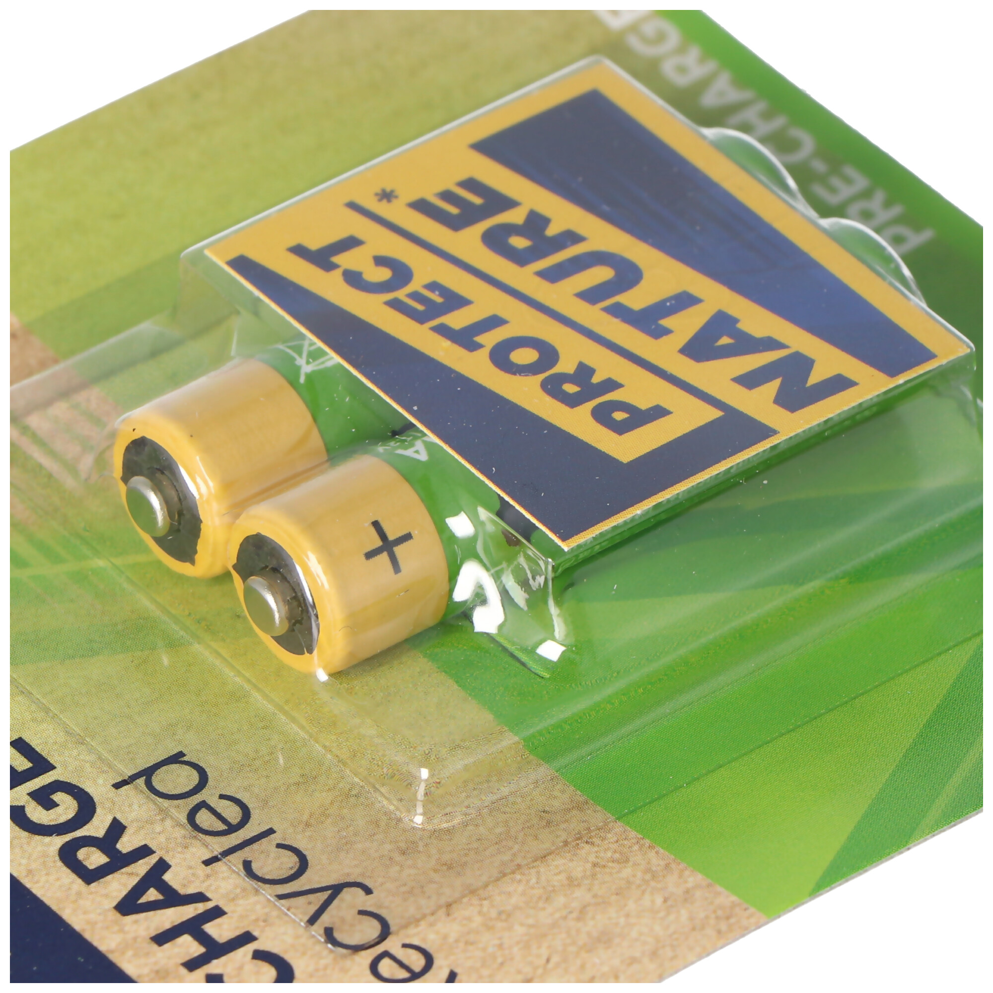 Two yellow AA batteries in a green and white blister pack.