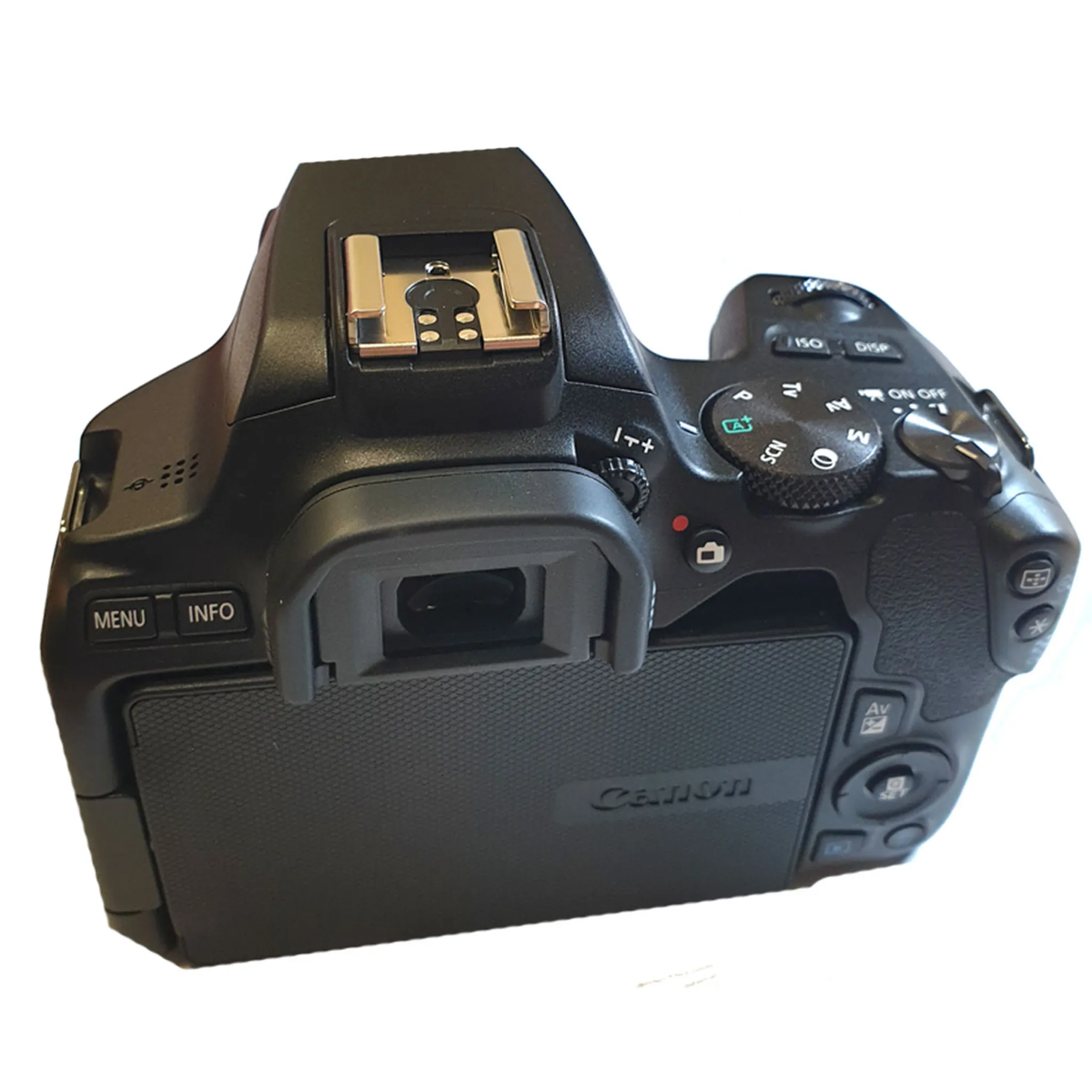 Vista posteriore della fotocamera Canon DSLR nera. Mostra pulsanti, uno schermo e il logo Canon.