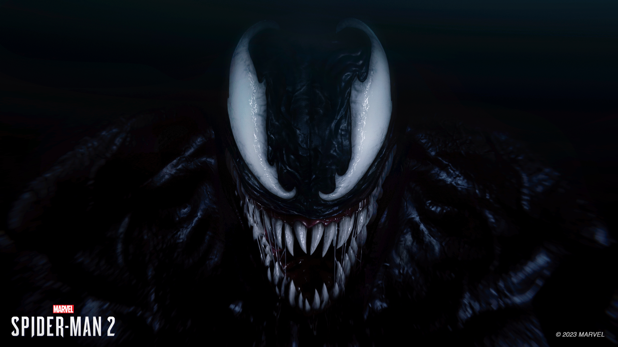 Il volto di Venom dal gioco Spider-Man 2. Nero, con occhi e denti bianchi. Sfondo scuro.