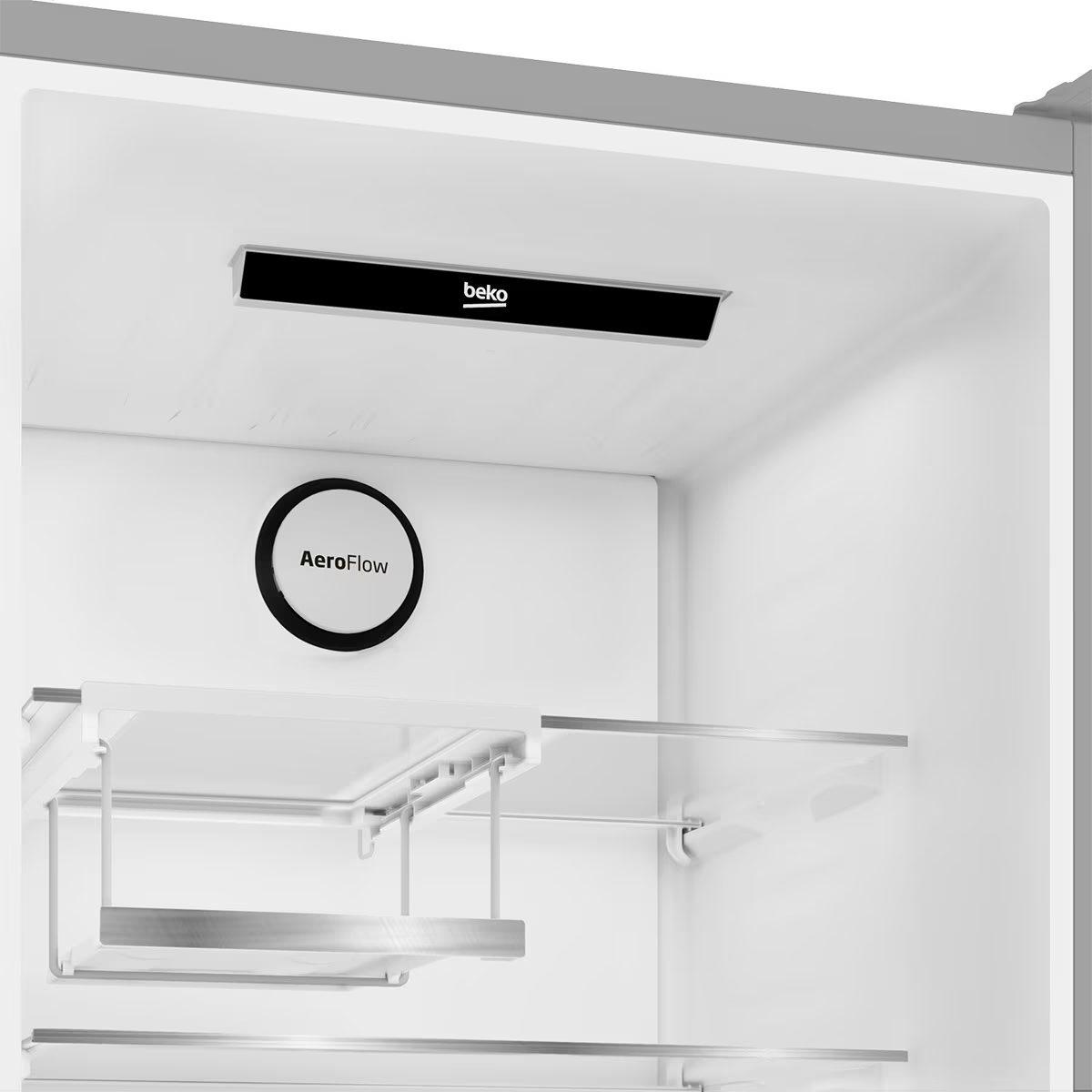 Dentro de un refrigerador Beko con estantes, etiqueta AeroFlow y panel superior negro.