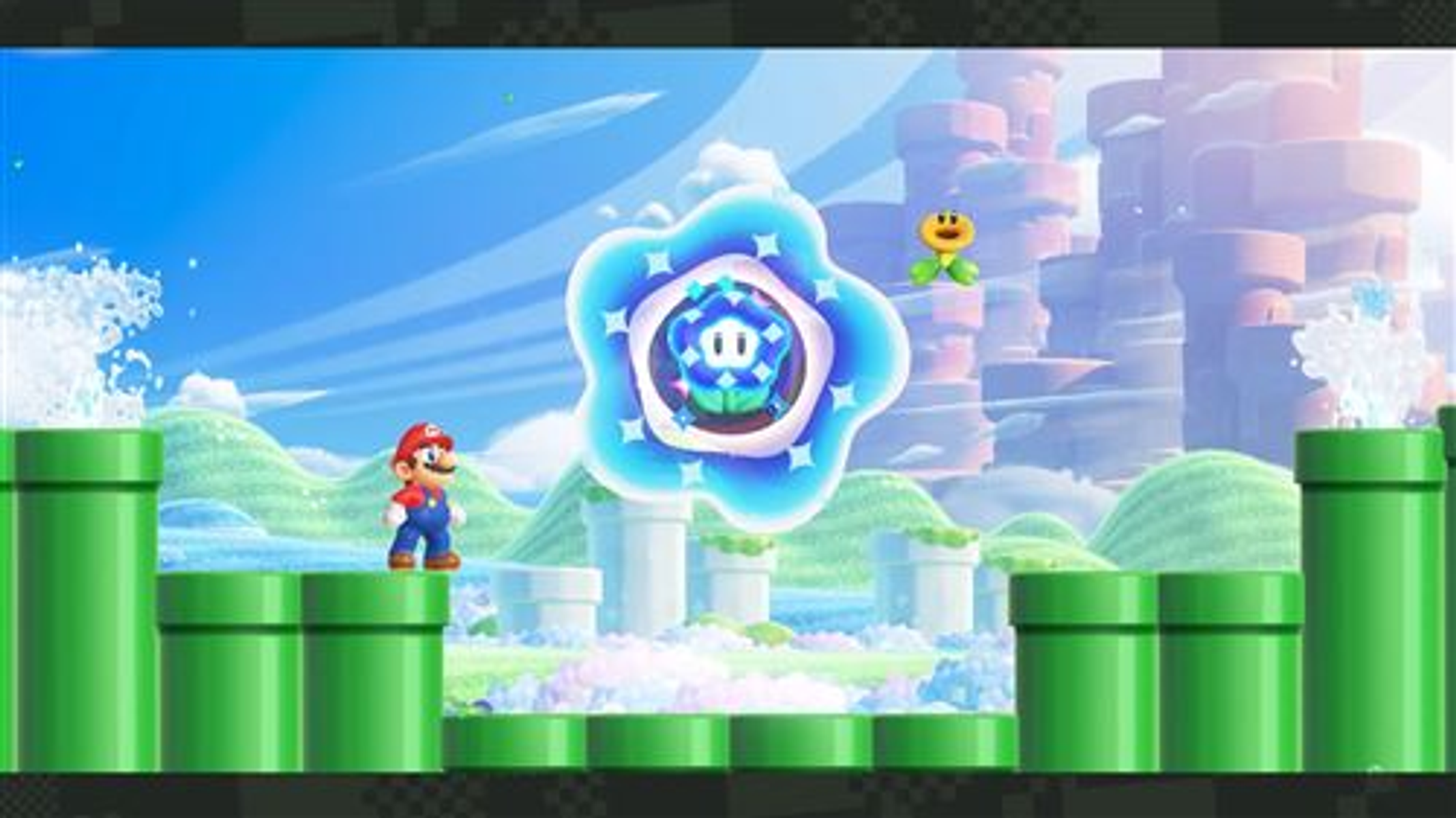 Mario w poziomie Super Mario Bros z zielonymi rurami, kwiatem i pływającą gwiazdą.