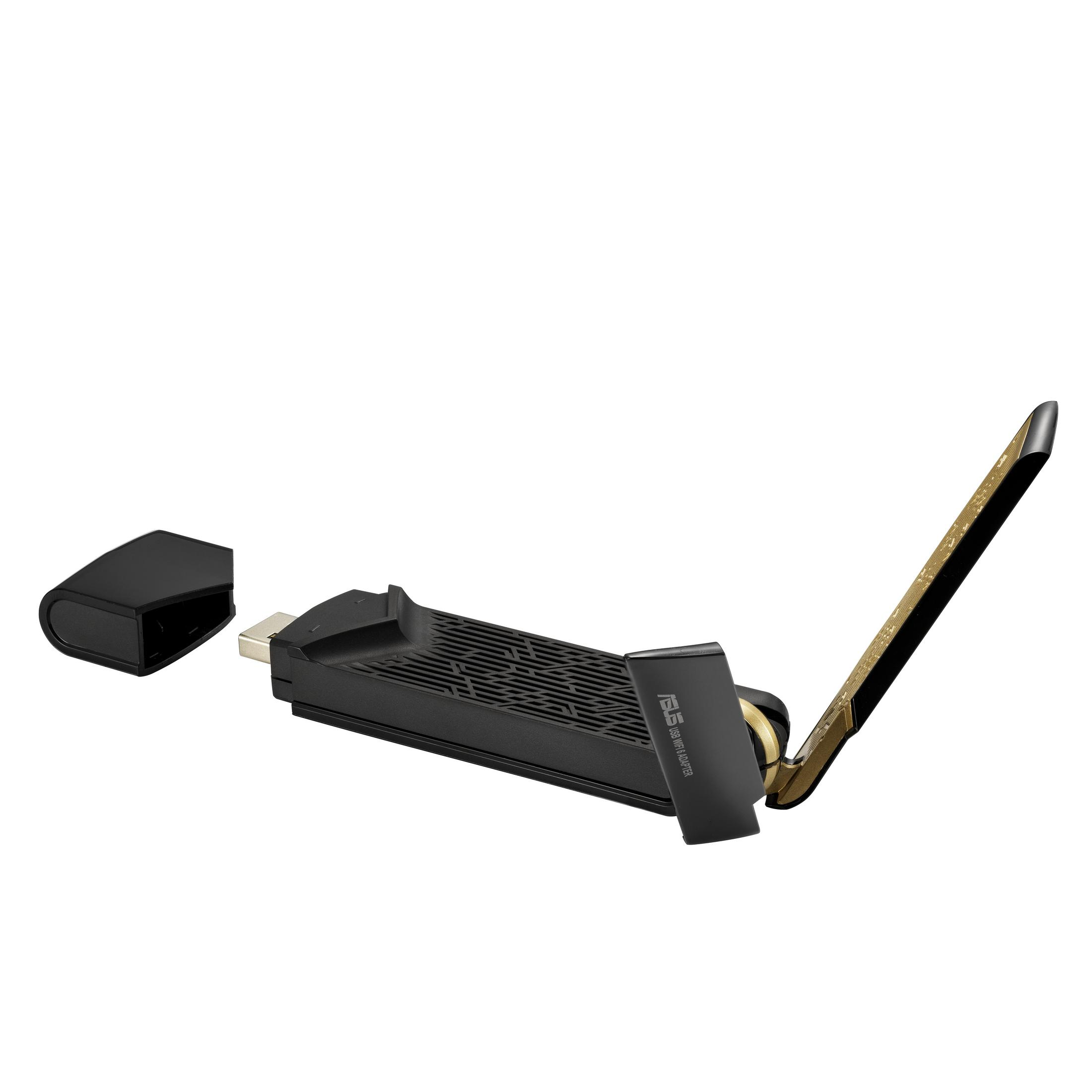 Adaptador inalámbrico negro y dorado con extensión de antena, tapa desprendida sobre fondo blanco.