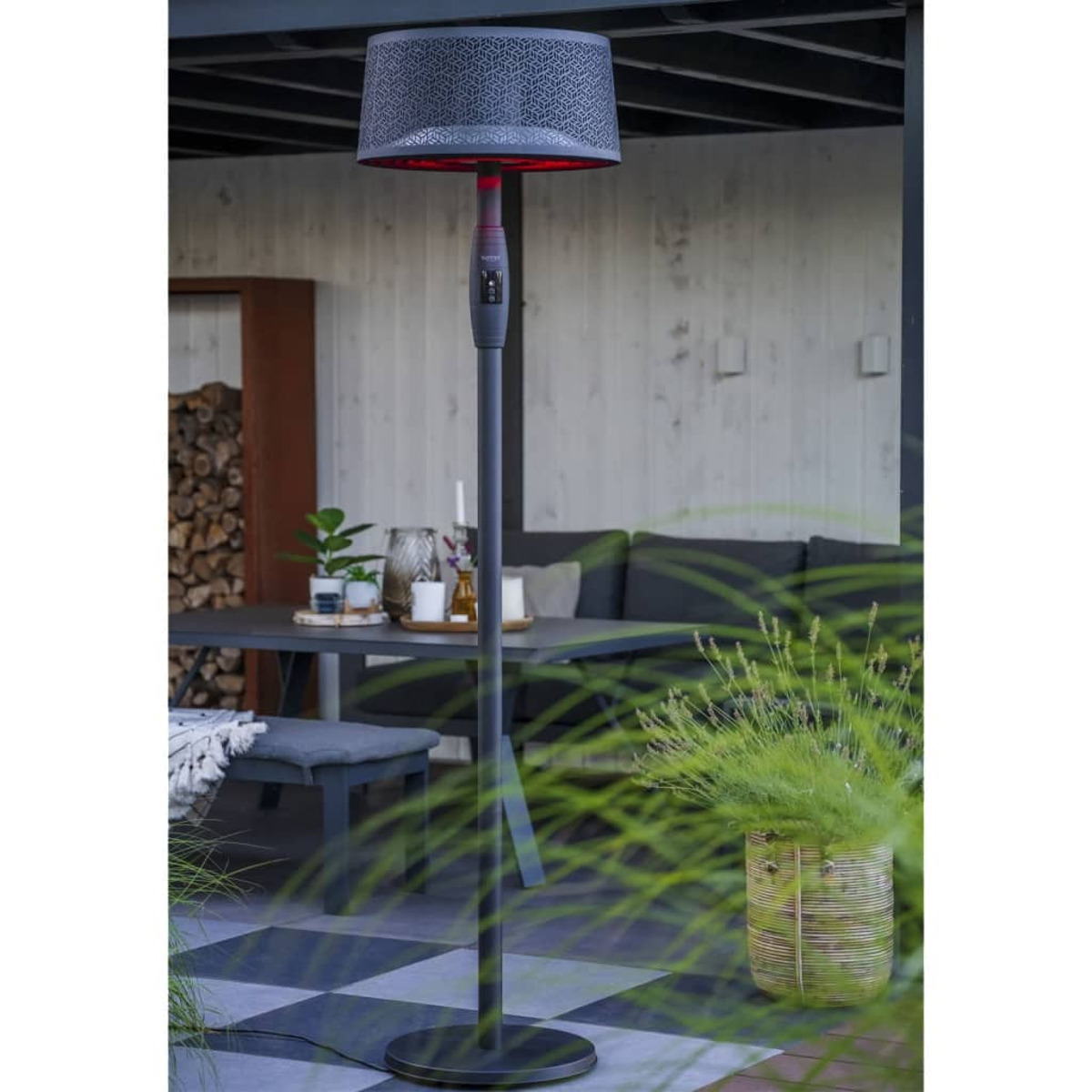 Tall outdoor heater, black, with a patterned top.