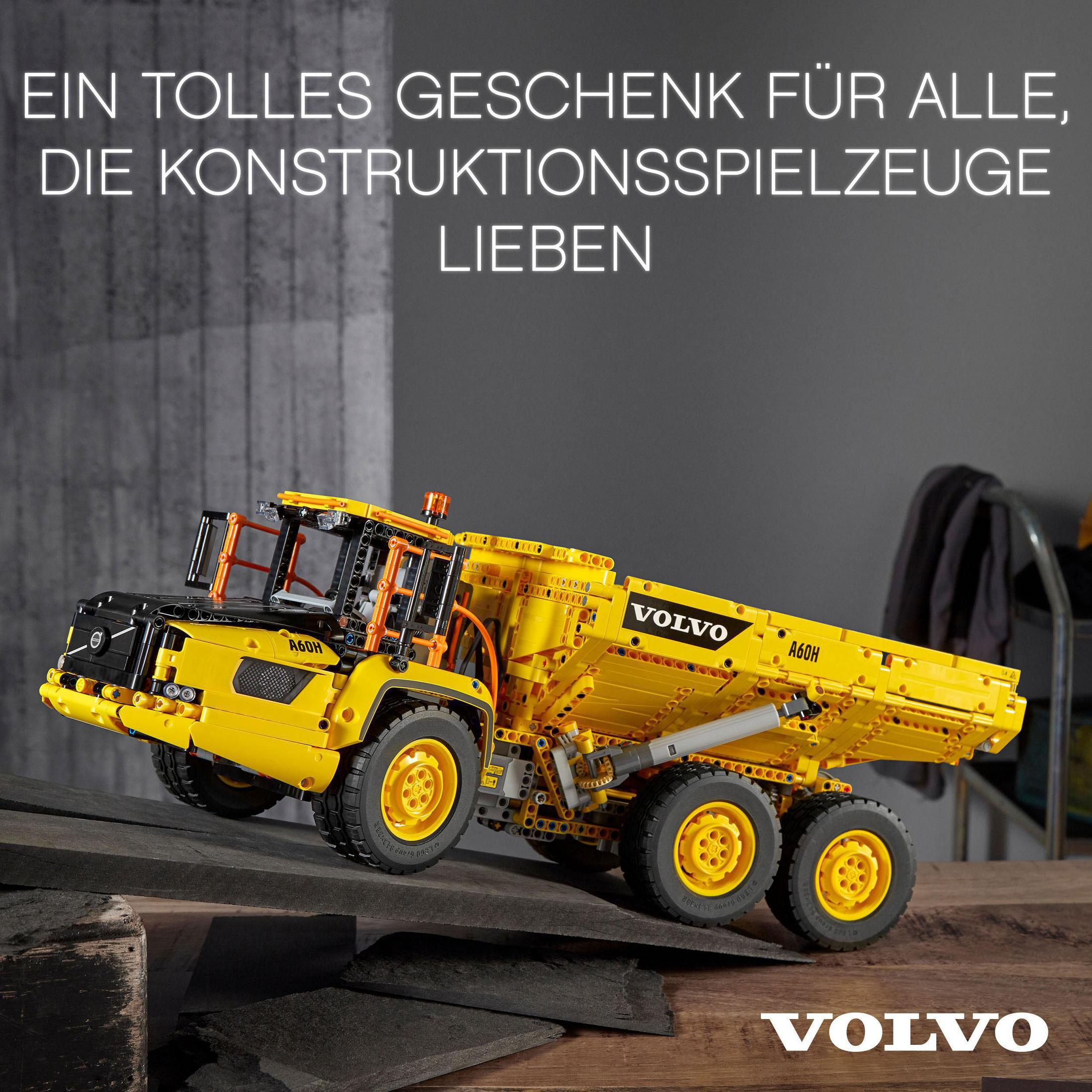 Gelbes Volvo-Truck-Modell. Schwarze Details. Text oben: "Ein tolles Geschenk für alle, die Konstruktionsspielzeuge lieben."