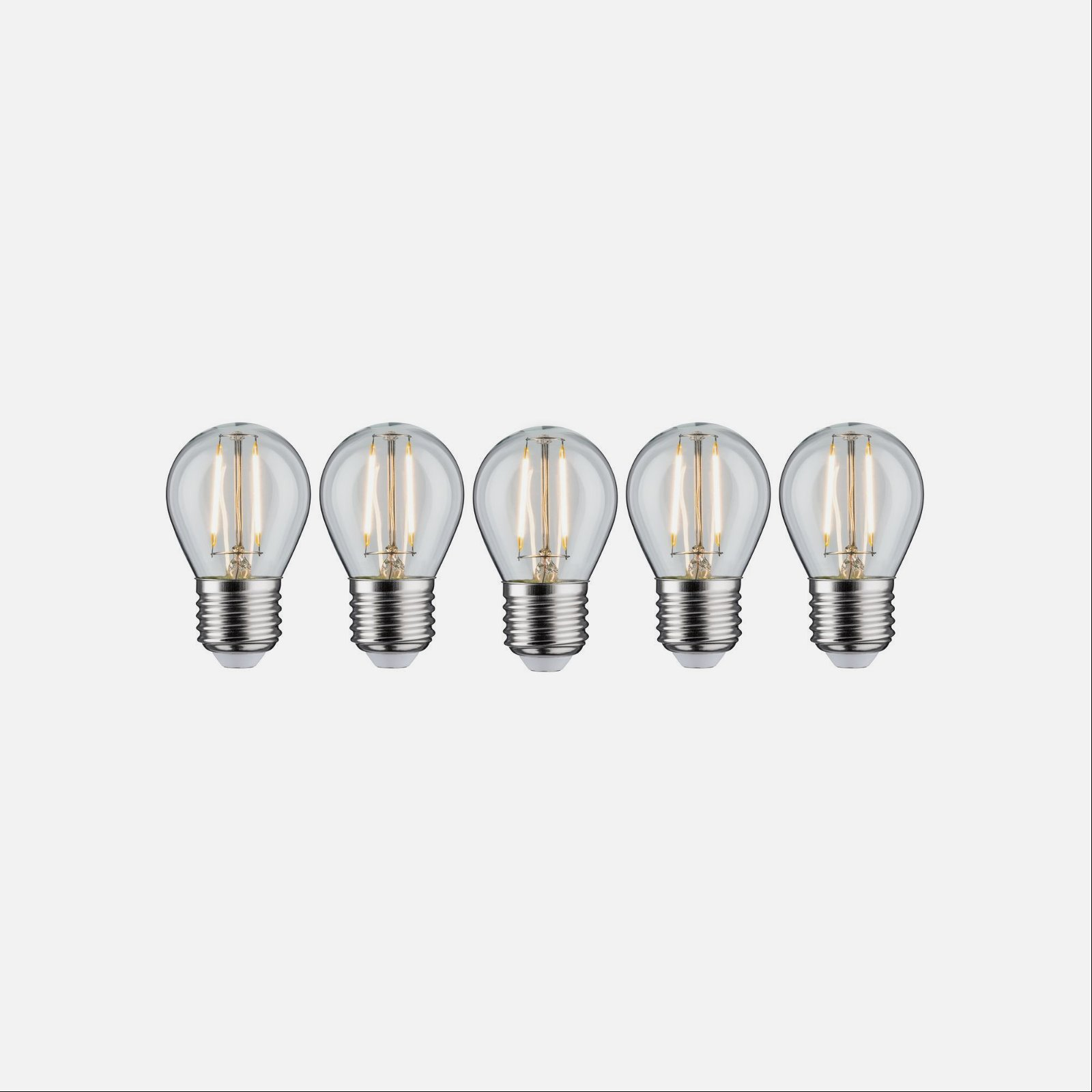 Rząd pięciu przezroczystych żarówek z widocznymi włóknami. Białe tło.
