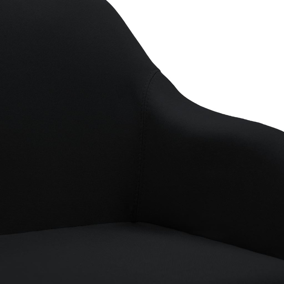 Nahaufnahme einer schwarzen Stuhllehne. Sie ist glatt und scheint aus Leder oder ähnlichem Material zu sein.