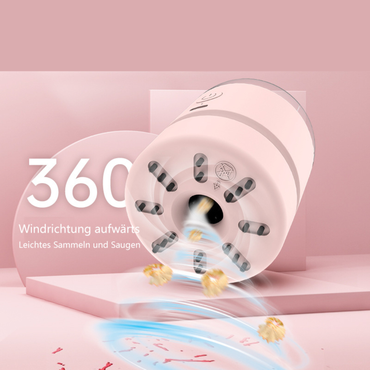 Rosa Staubsauger mit 360-Grad-Saugdesign. Kleine Staubpartikel sind zu sehen.