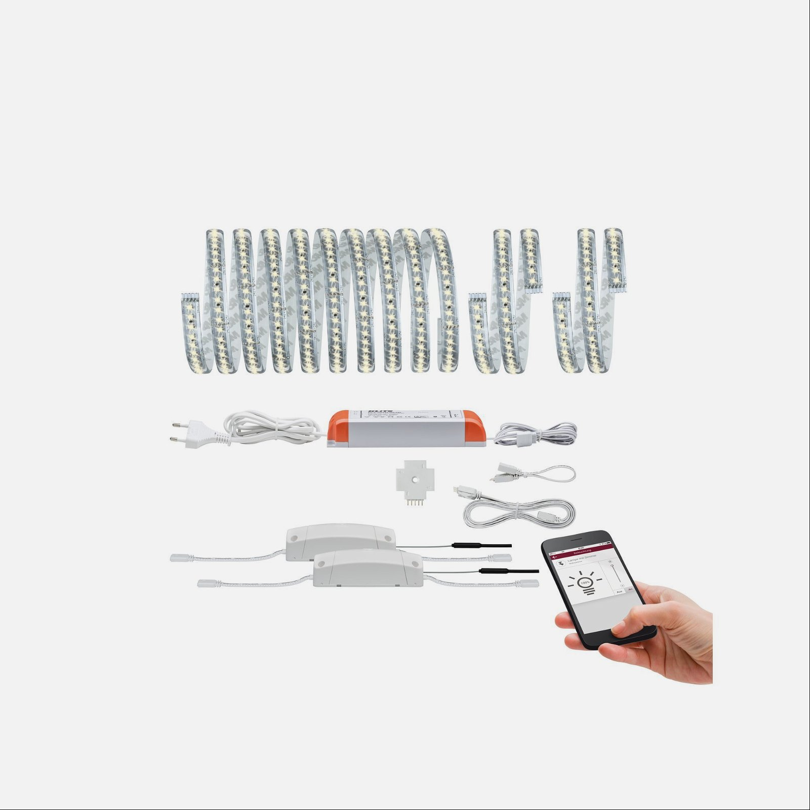 Pasek diod LED i akcesoria są starannie ułożone na białej powierzchni.