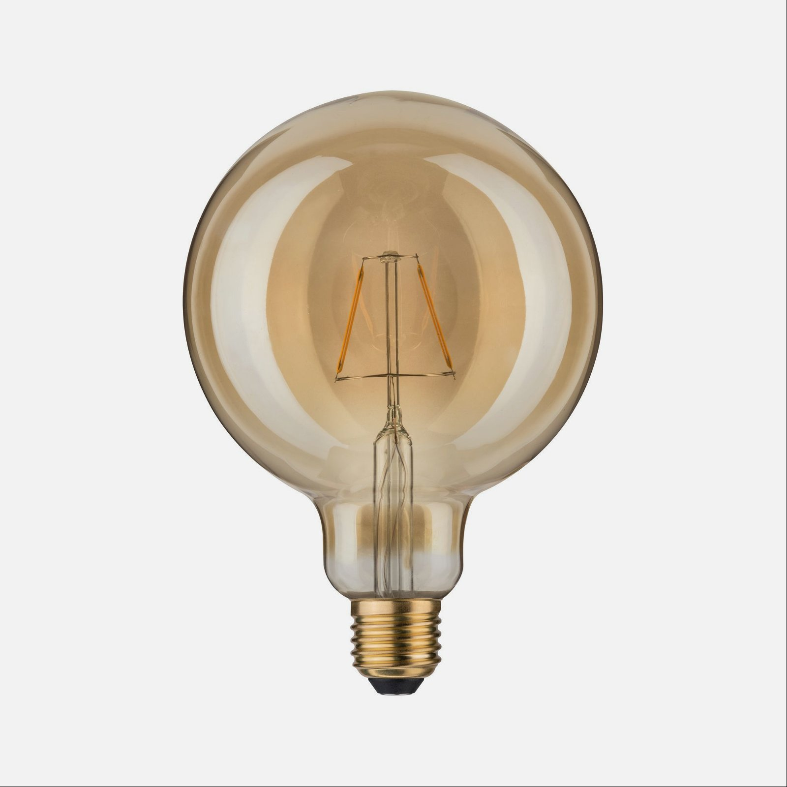 Duża, bursztynowa żarówka z dekoracyjnym włóknem, na białym tle.