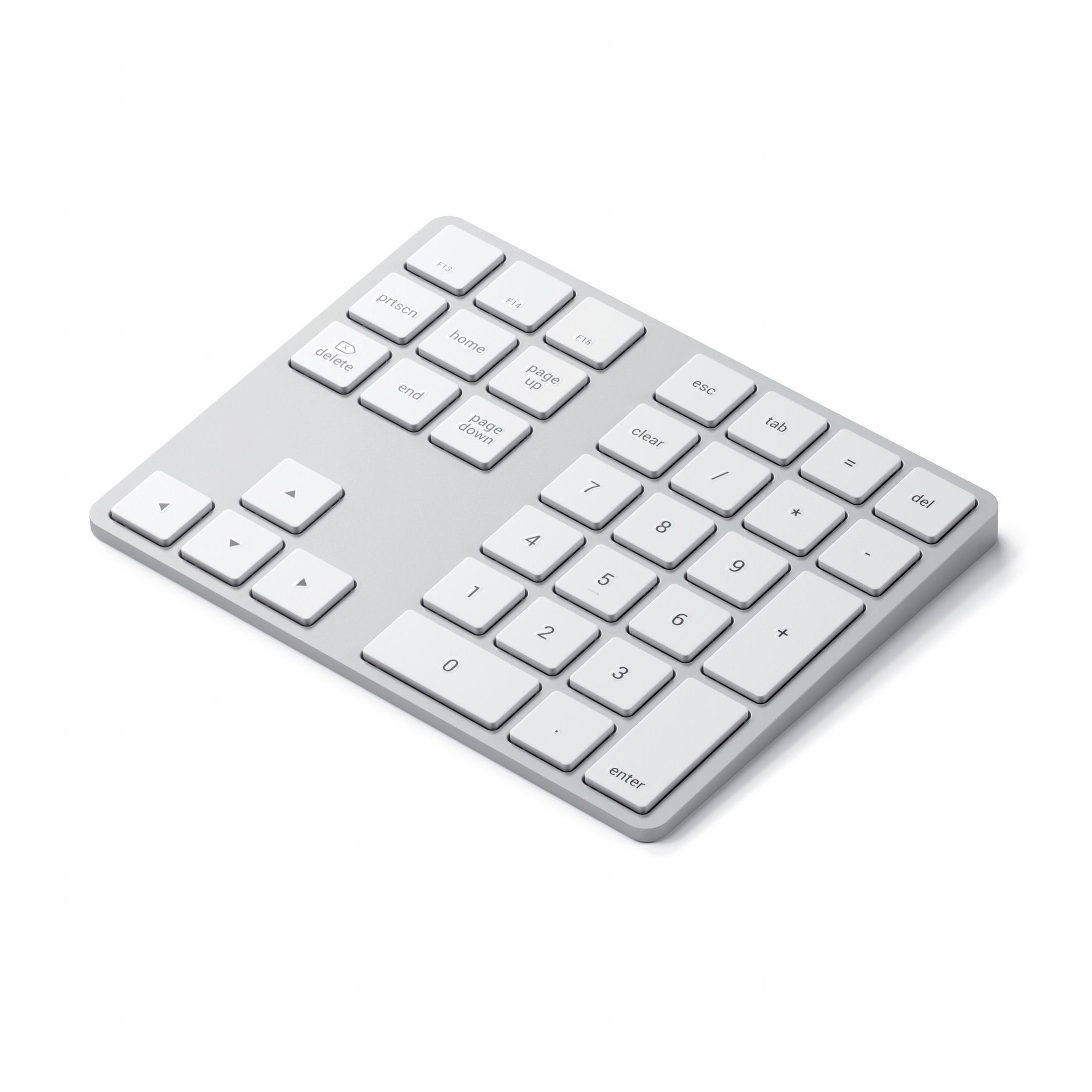 Ein silberner Numpad-Keyboard mit weißen Tasten. Das Keyboard hat ein minimalistisches Design.