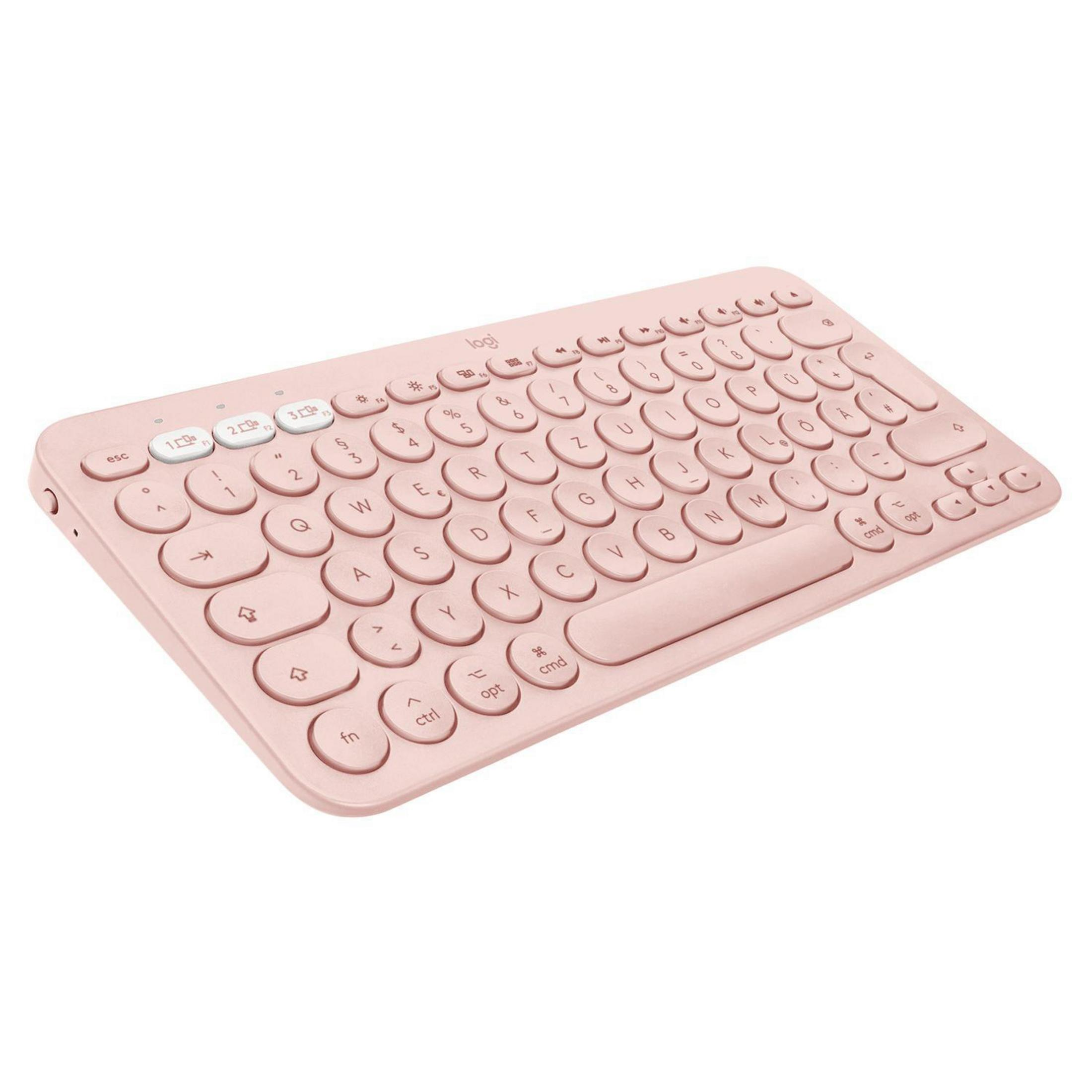 Różowa klawiatura Logitech. Okrągłe, białe klawisze, białe tło.