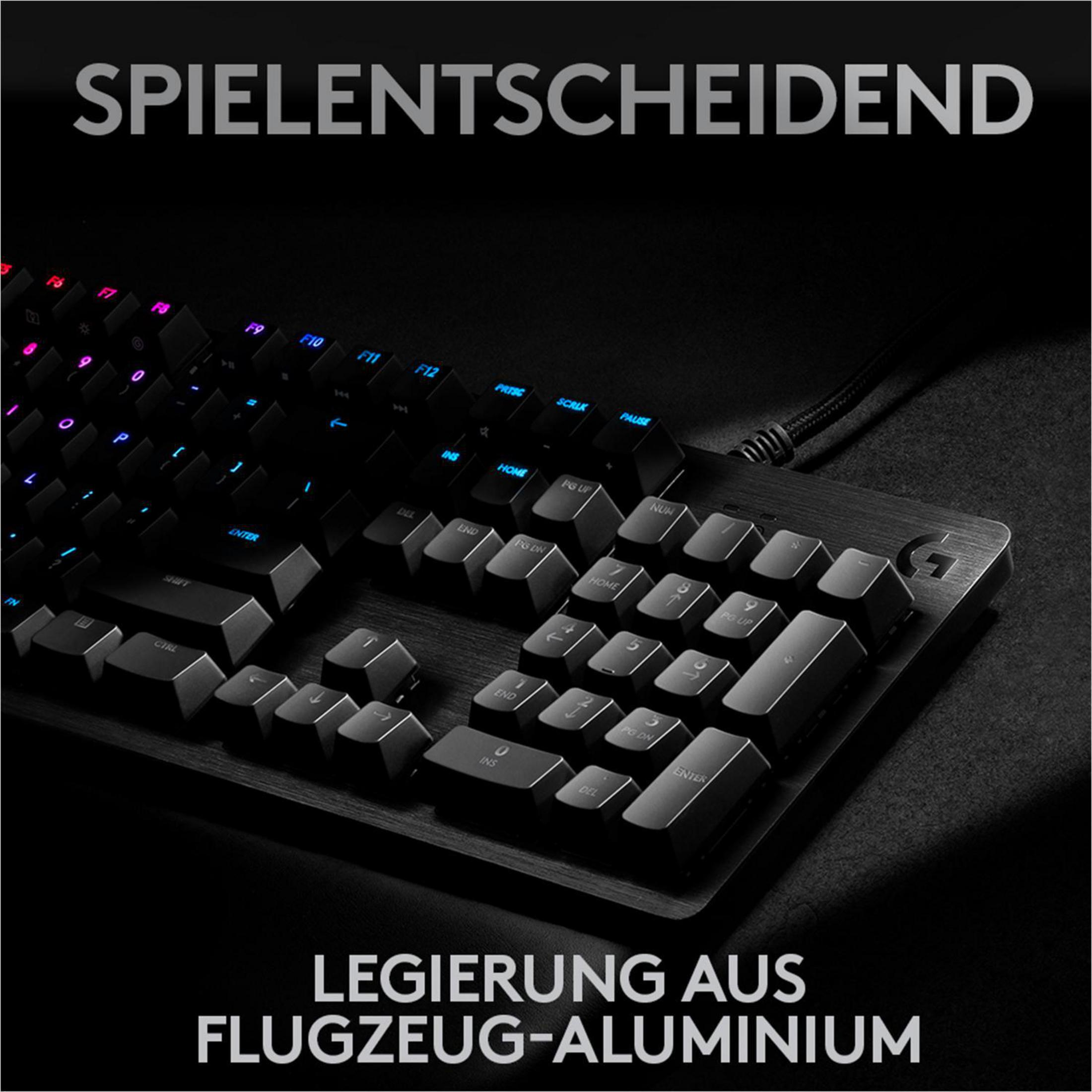 Close-up of a keyboard with illuminated keys. German text at the top and bottom of the image.