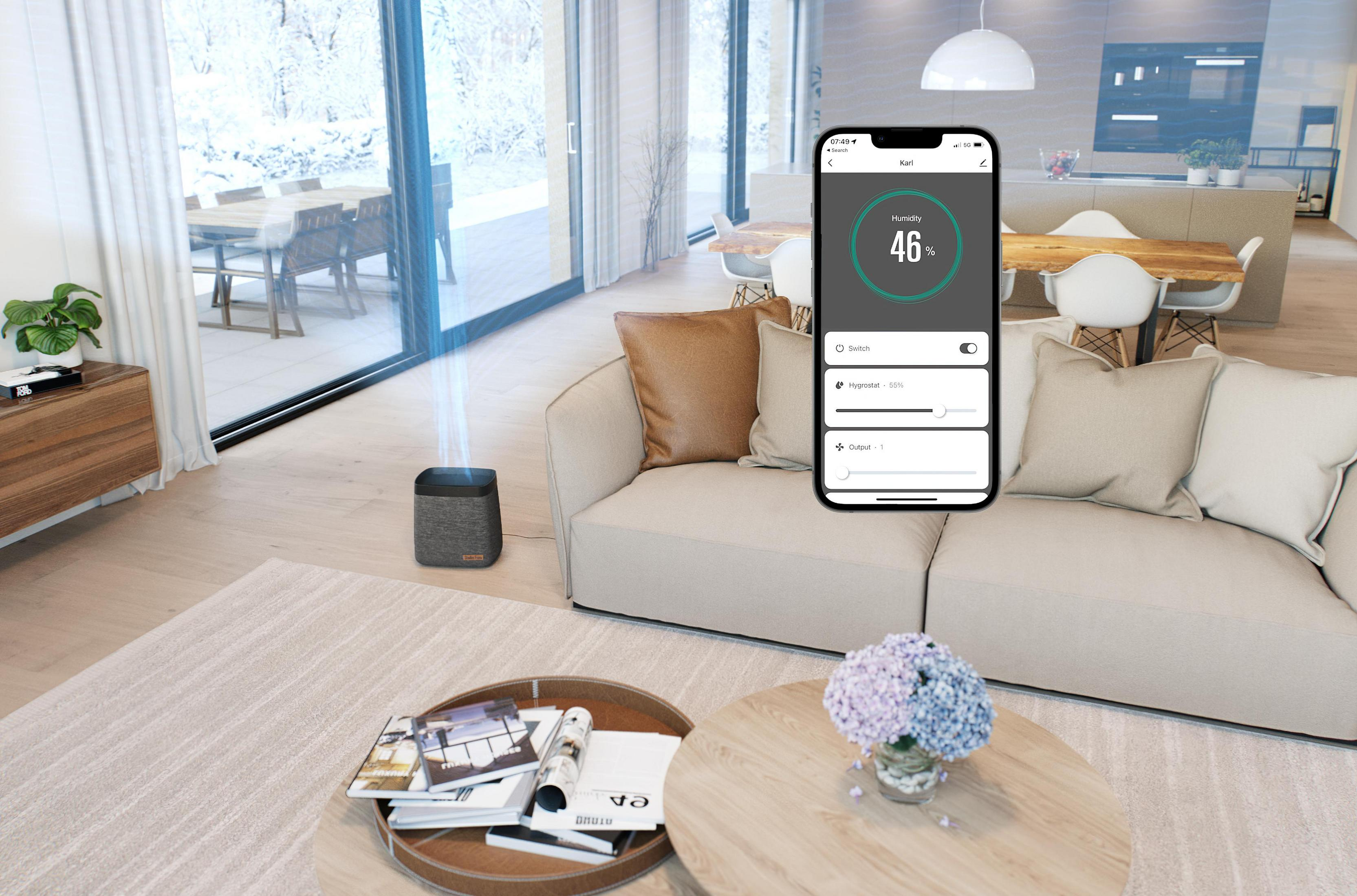 Un moderno soggiorno con un dispositivo intelligente. Umidificatore, telefono con dati e divano.