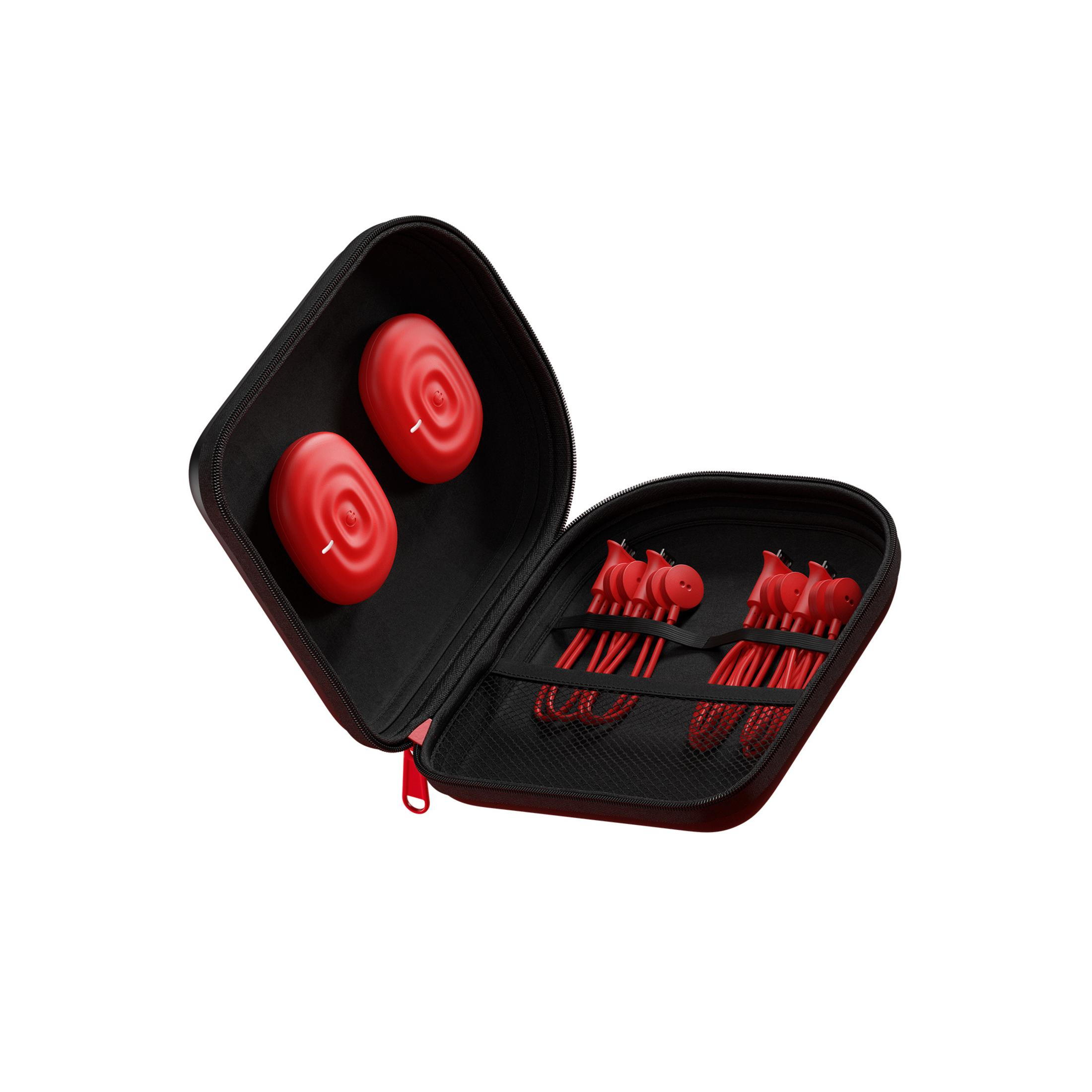 Estuche negro abierto con objetos rojos dentro. Dos objetos rojos arriba, cables y objetos rojos abajo.