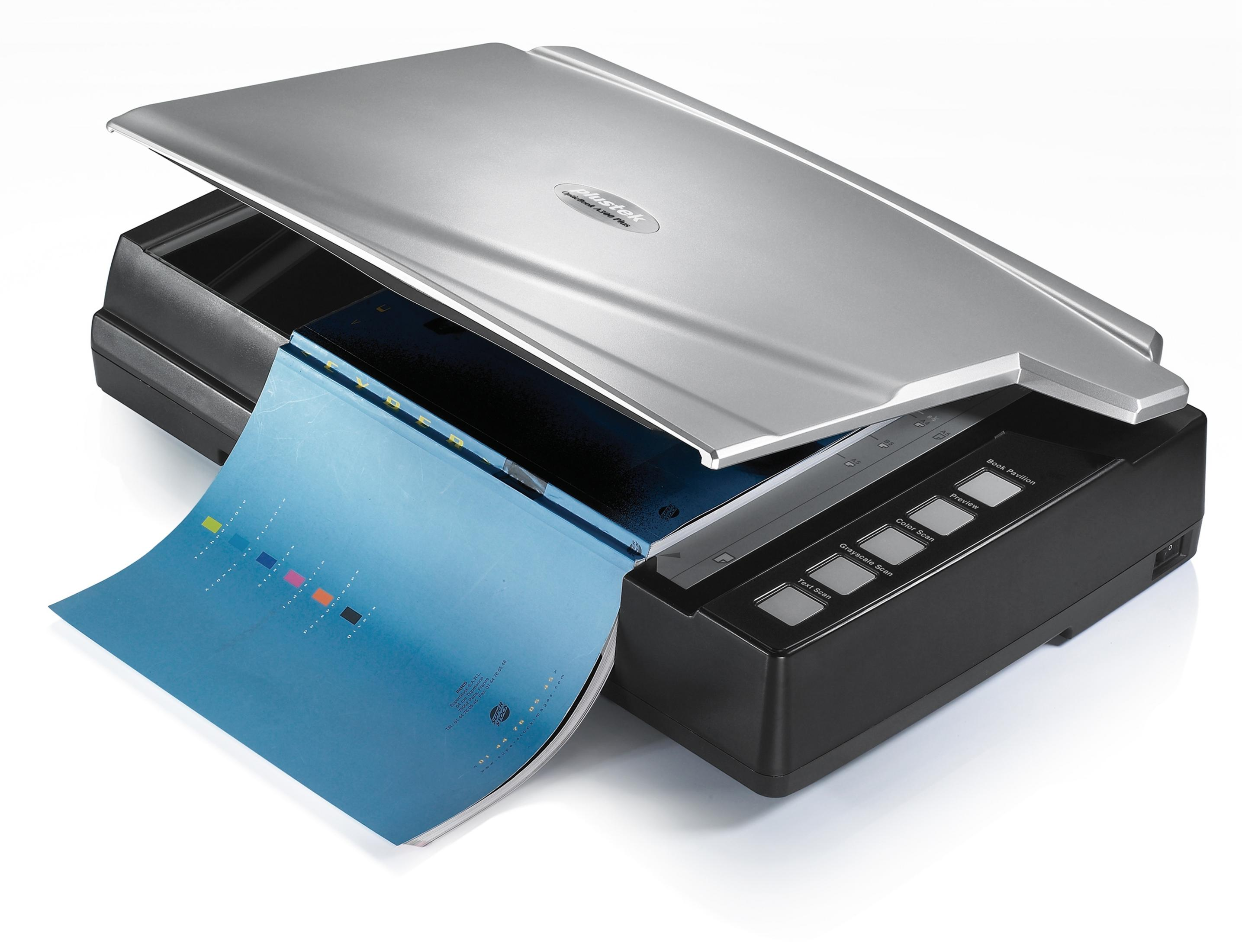 Srebrny skaner z otwartą pokrywą, pokazujący skanowaną książkę, z wieloma przyciskami.