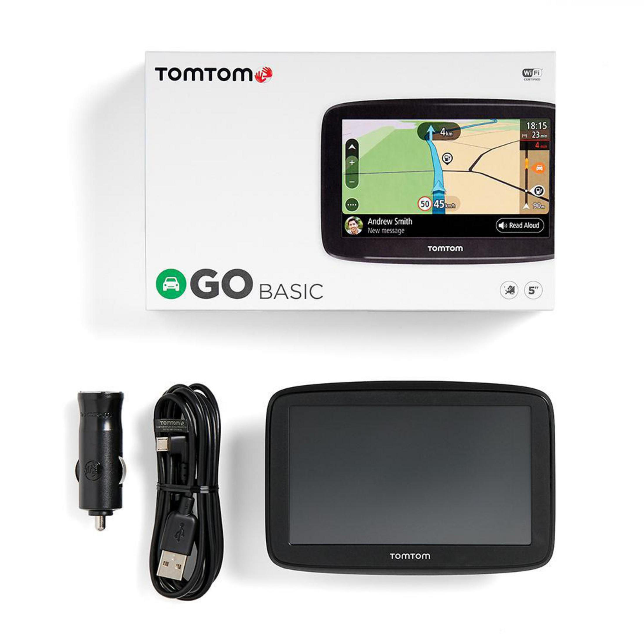 Ein TomTom GPS-Gerät und Zubehör, einschließlich einer Box und Ladekabel.