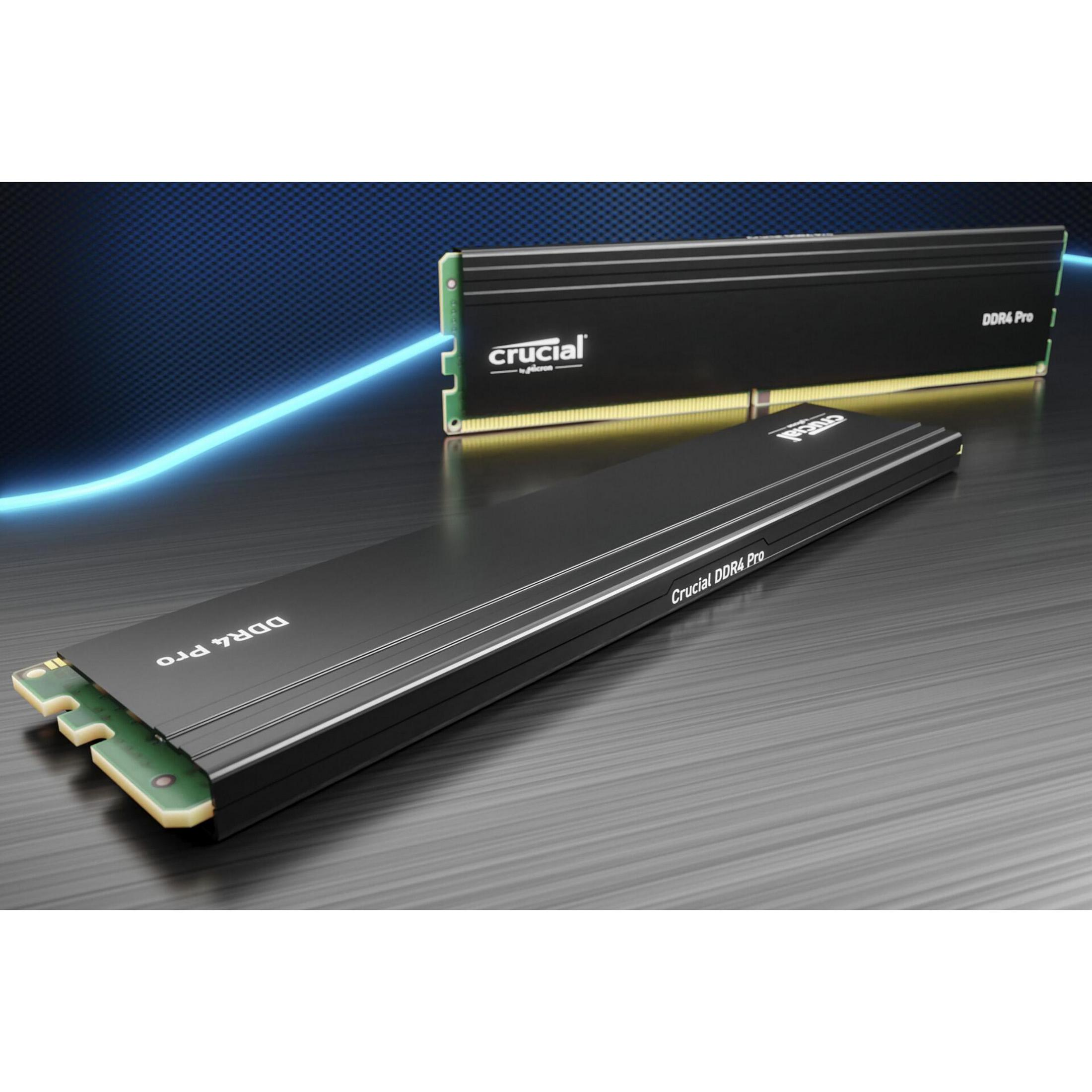 Dos memorias RAM Crucial DDR4 Pro negras. Una sobre la mesa y otra encima.
