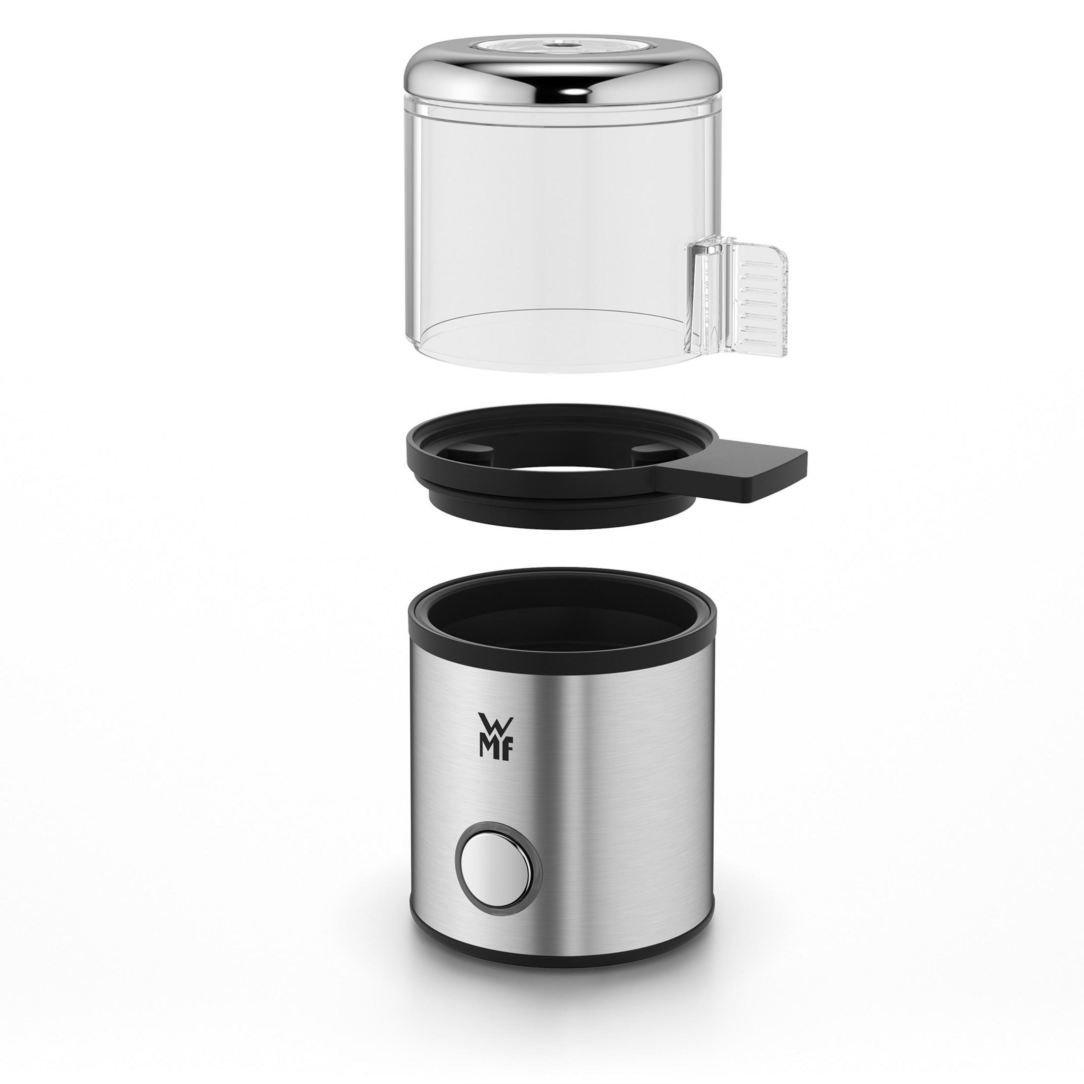 Zdemontowany sprzęt kuchenny ze stali nierdzewnej i przezroczystego tworzywa sztucznego z przyciskiem.