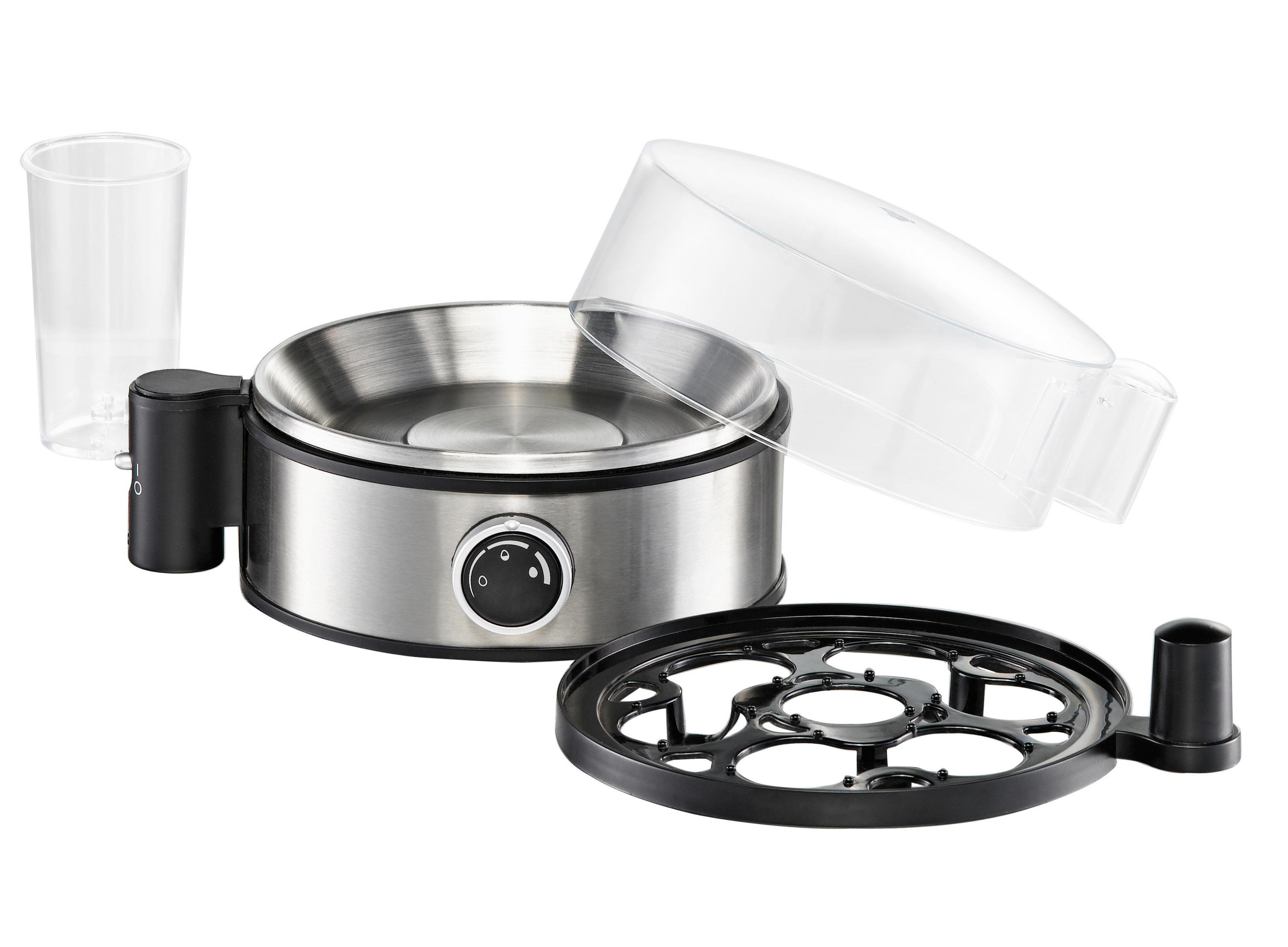 Srebrno-czarny garnek do gotowania jajek z akcesoriami. Białe tło.