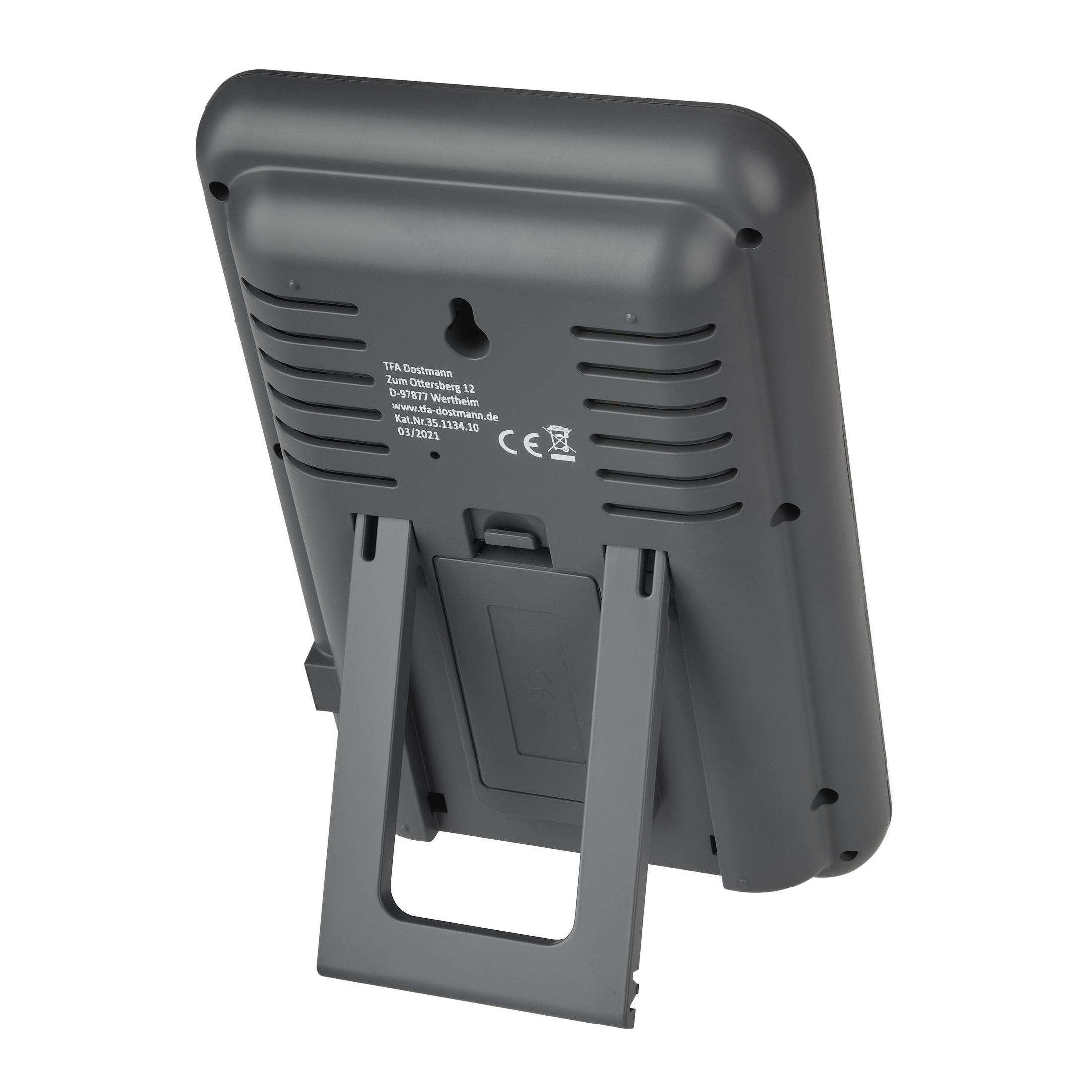 Ein graues Thermometer mit Ständer. Es hat eine Digitalanzeige und Text auf der Rückseite.
