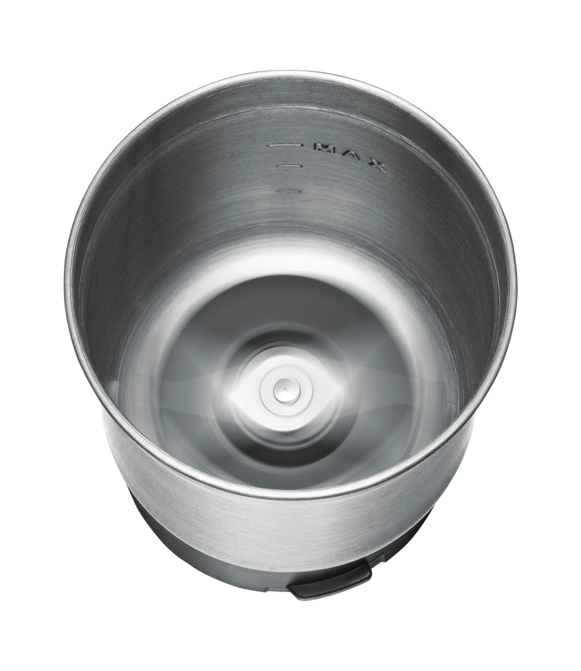 Wnętrze blendera ze stali nierdzewnej. Dno i boki widoczne na białym tle.