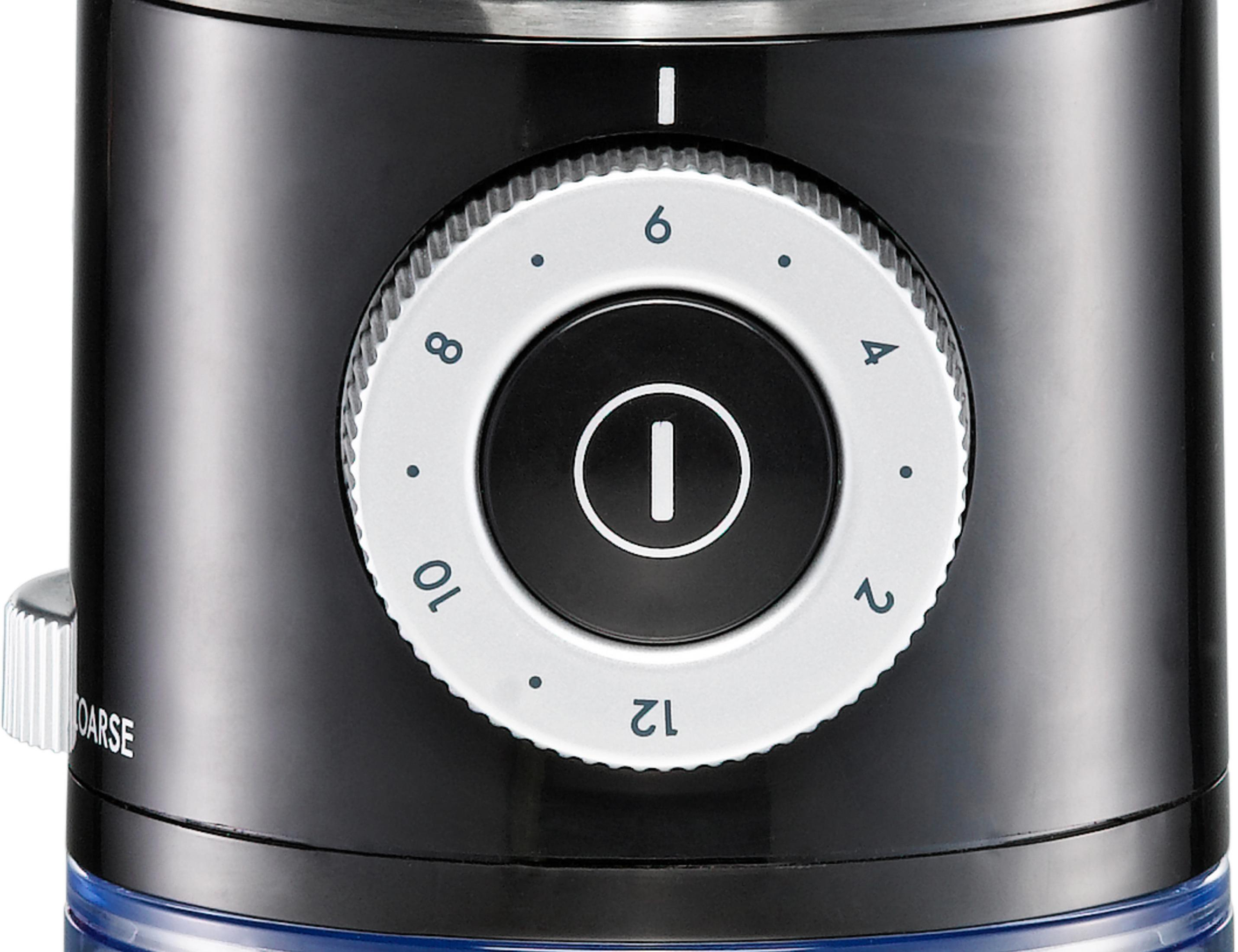 Zbliżenie czarno-białej tarczy z numerami i centralnym przyciskiem. Tarcza jest przeznaczona do młynka.