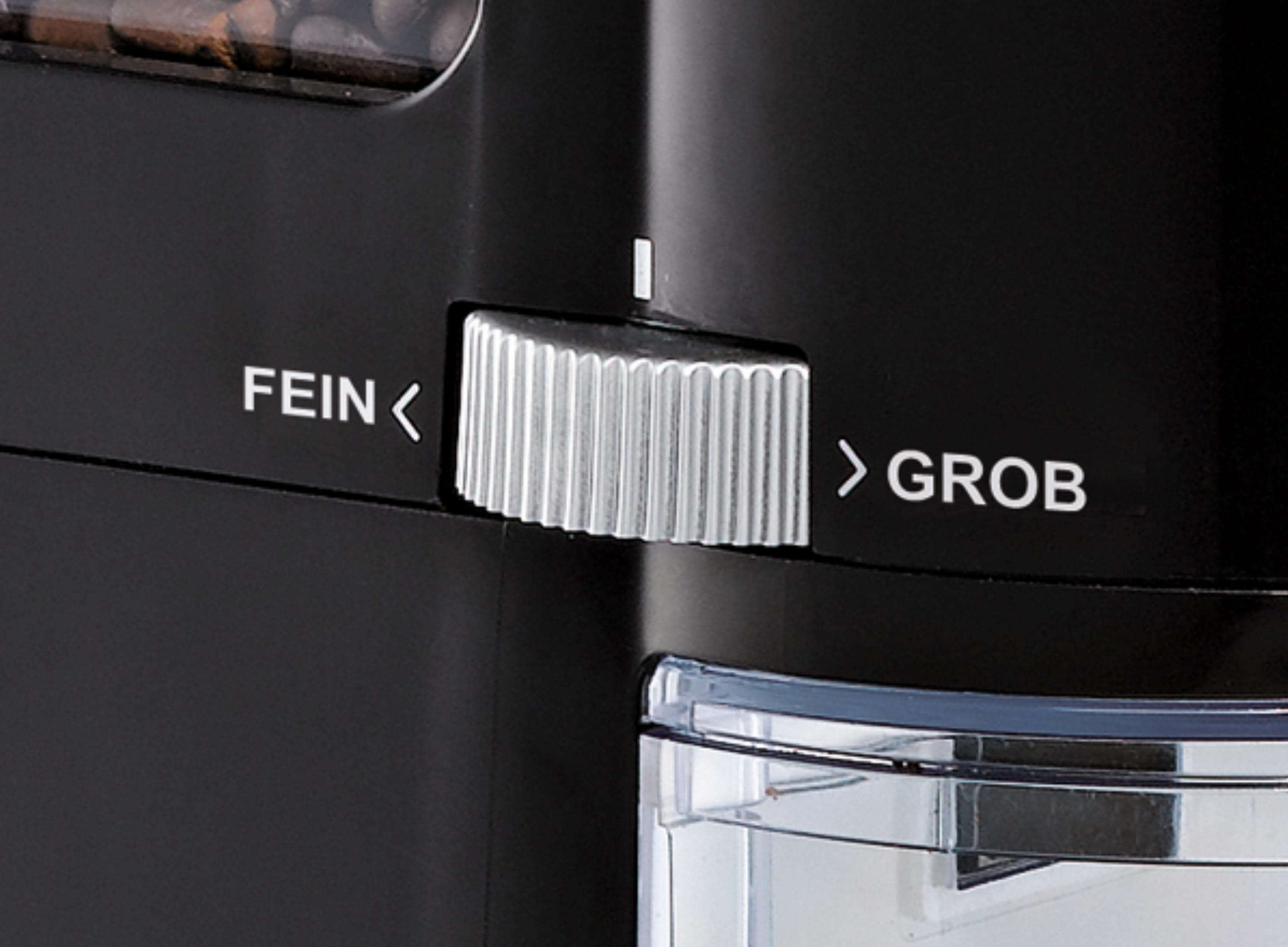 Czarny młynek do kawy ze srebrnym pokrętłem regulacji z napisem 'FEIN' i 'GROB'.