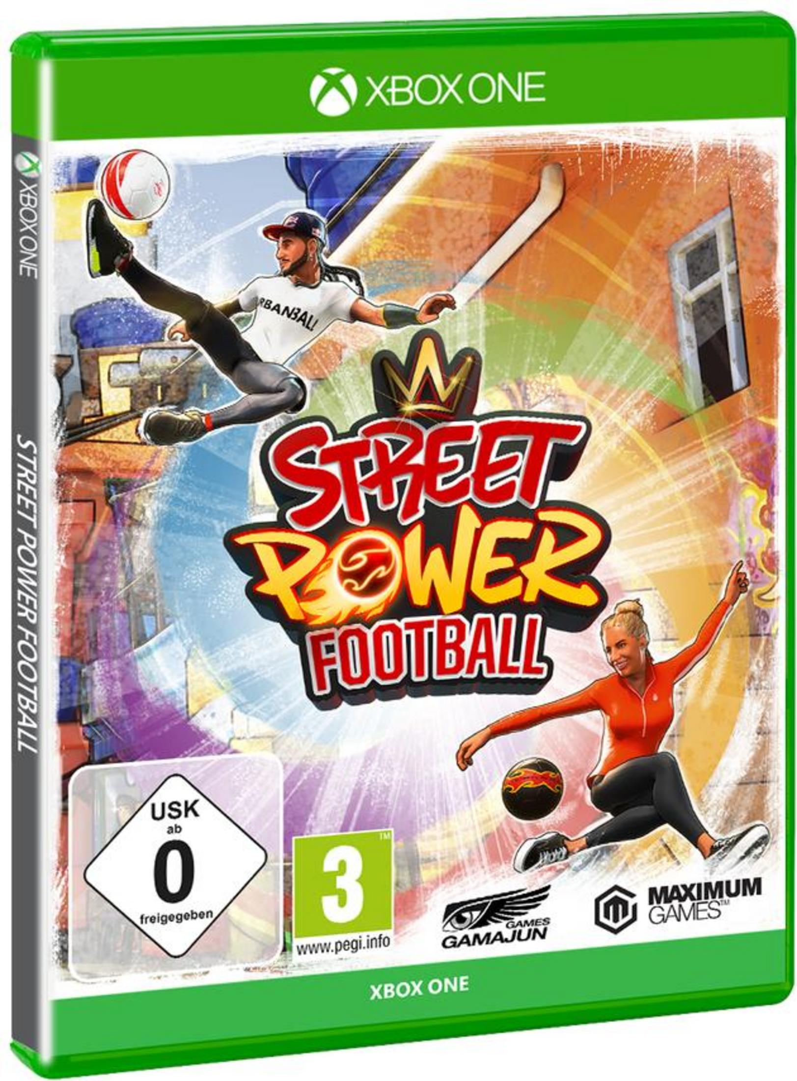 Street Power Football Spielcover. Zwei Spieler in Aktion mit einem lebendigen Stadt-Hintergrund. Grüne Box.