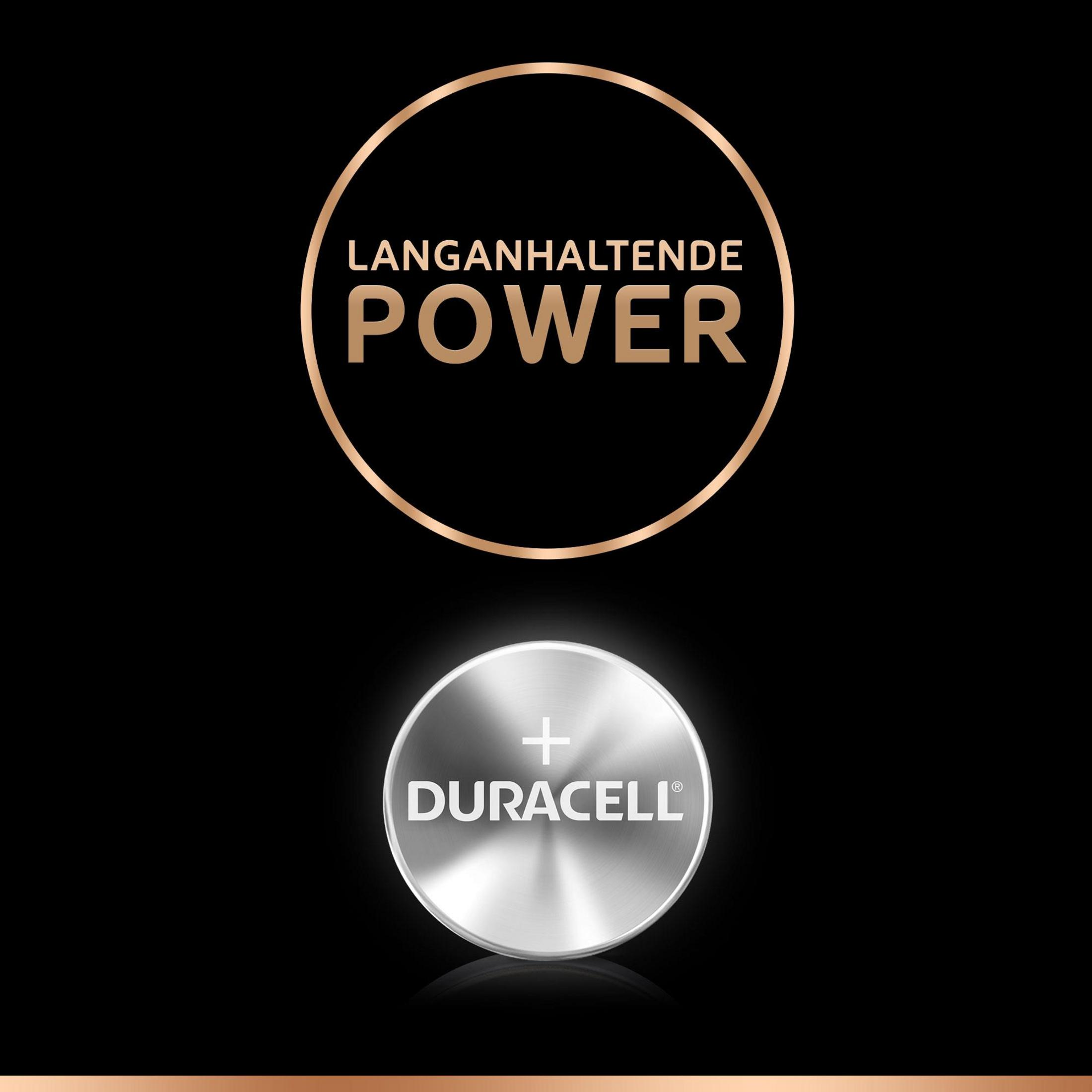 Bateria Duracell z napisem 'Langanhaltende Power' w złotym okręgu na czarnym tle.