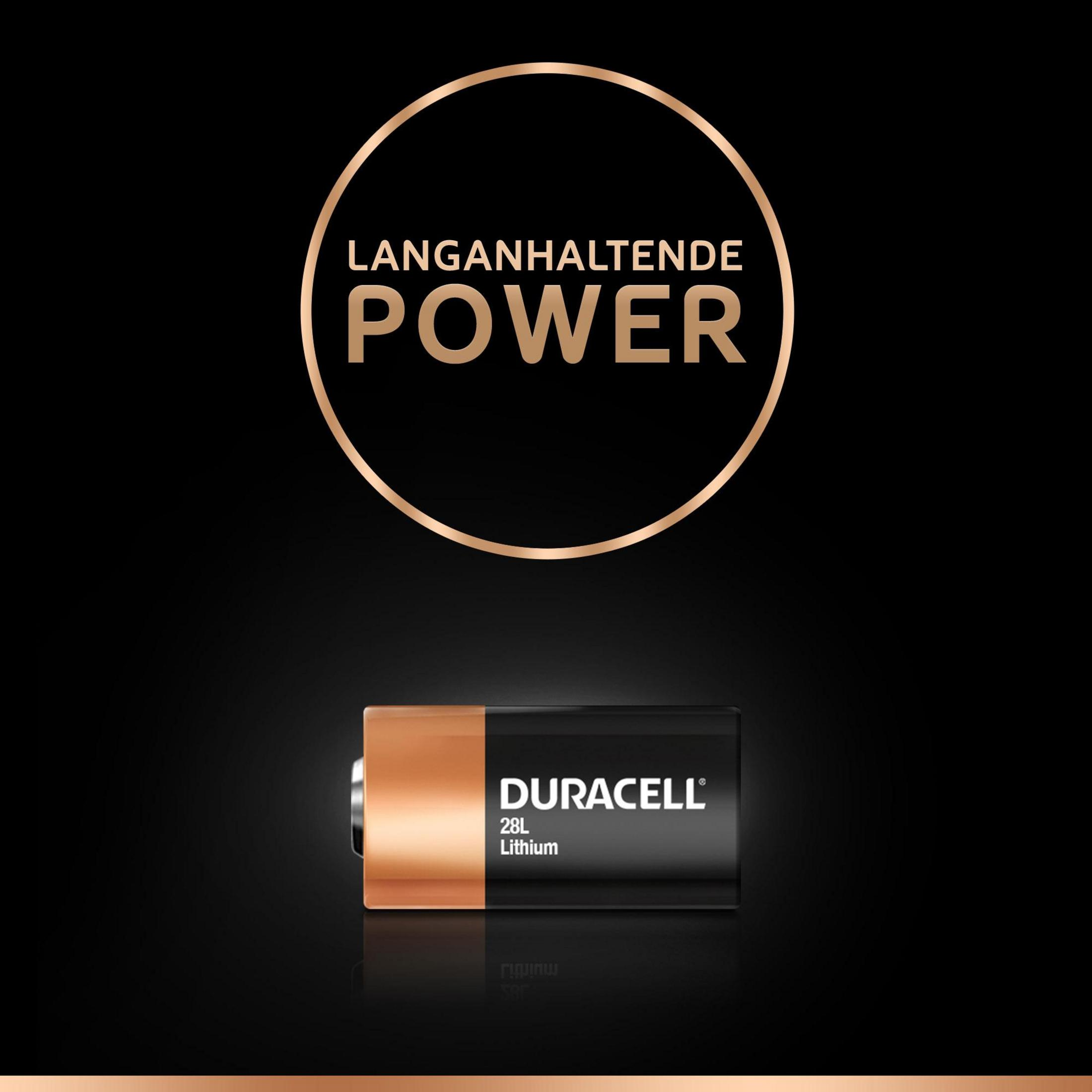 Bateria Duracell na czarnym tle. Złoty okrąg z tekstem 'POWER'. Czarne tło z odbiciem.