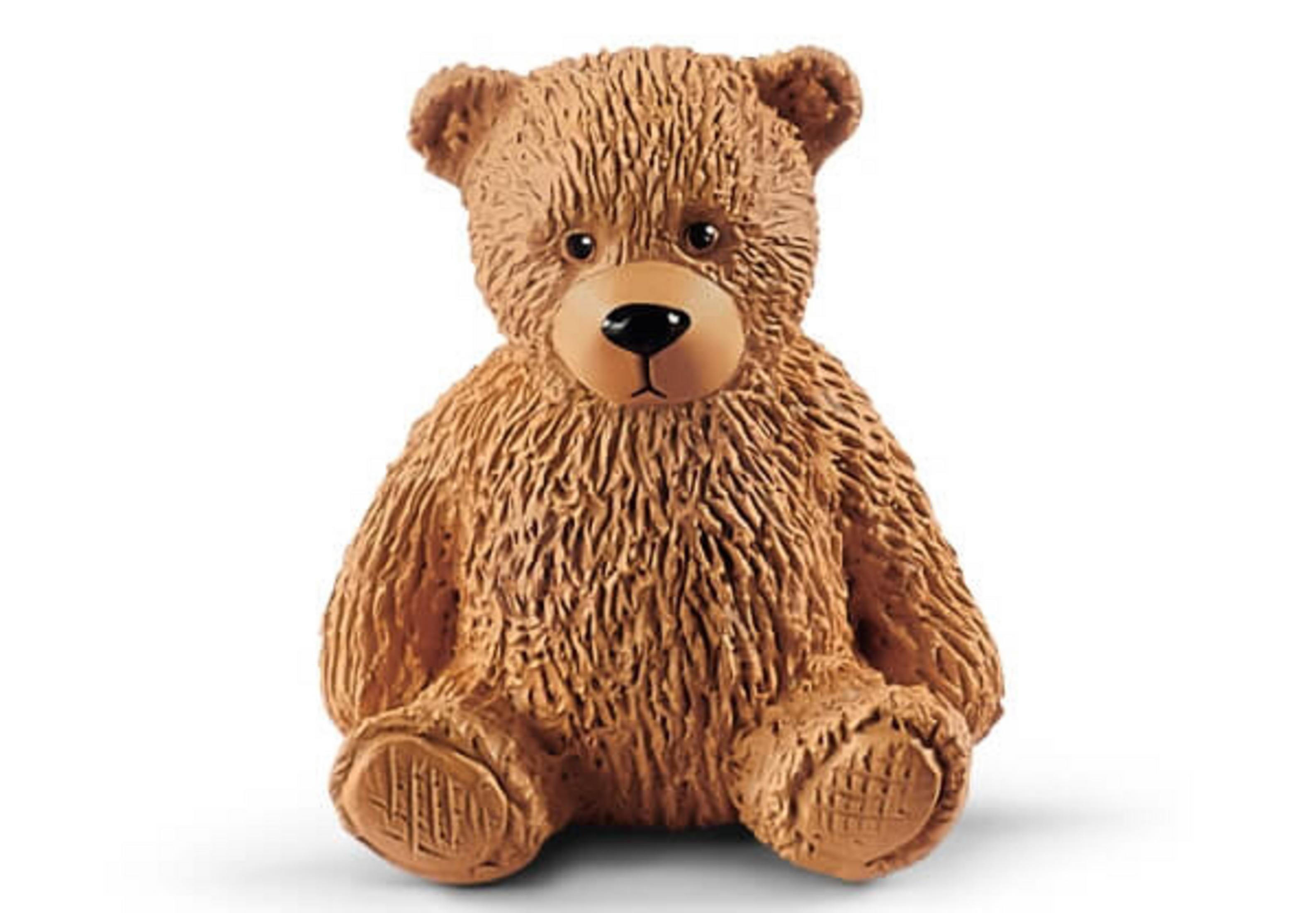 Ein brauner Teddybär sitzt aufrecht, mit schwarzer Nase und braunem Fell, auf weißem Hintergrund.