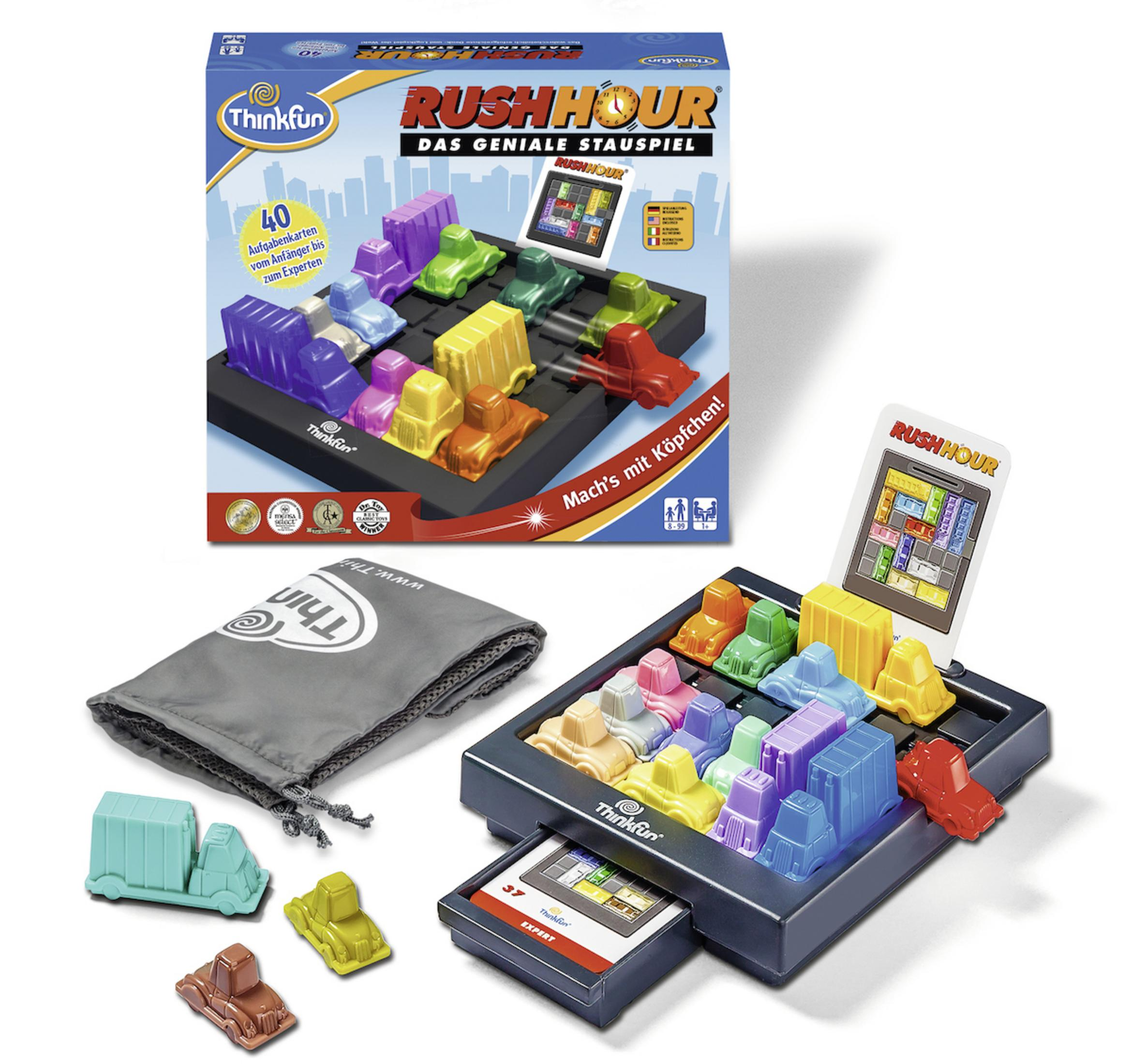 Ein Rush Hour Spielset. Die Box zeigt Autos auf einem Raster. Das Set enthält Autos, ein Spielbrett und eine Tasche.