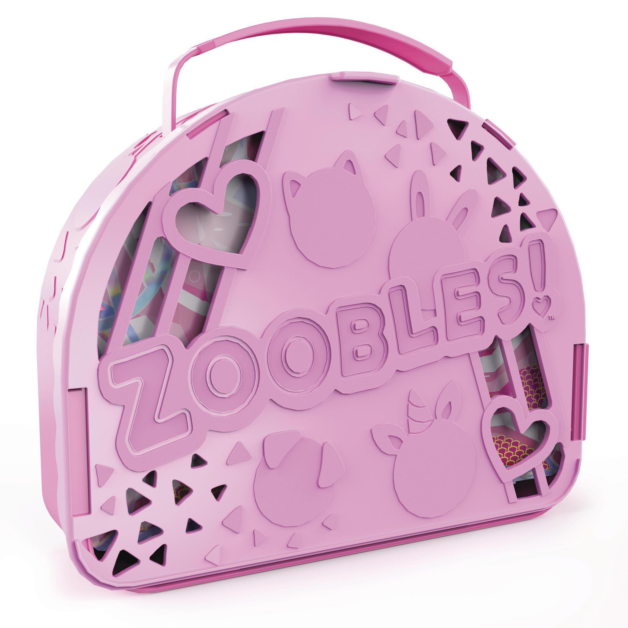 Rosa Zoobles-Tragetasche mit Ausschnitten von Herzen, Katze, Hund und anderen Formen. Ein Griff ist oben.