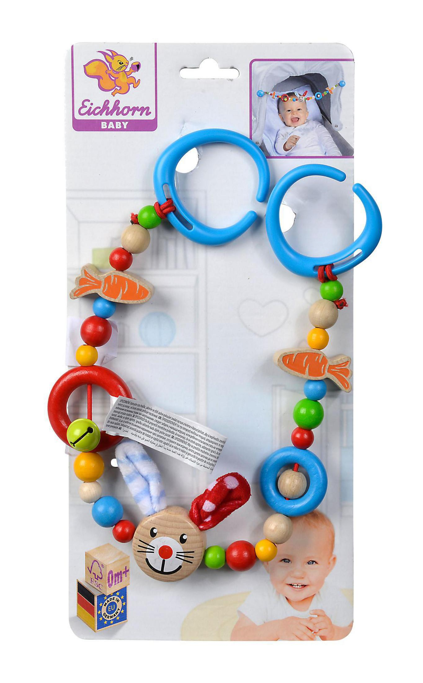 Babyspielzeug mit Perlen, blauen Reifen, Holzperlen, einem Hasen und einem lächelnden Baby.