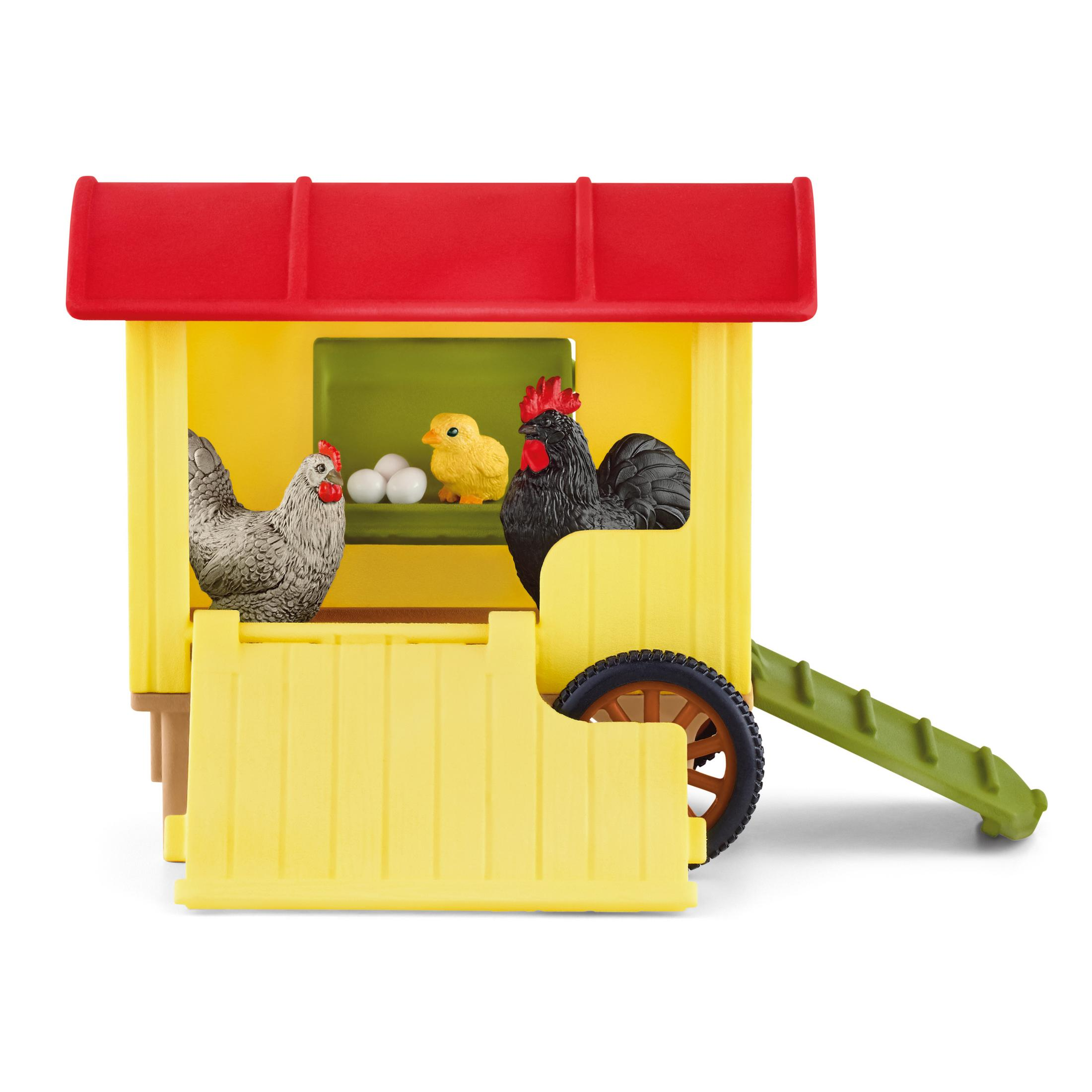 Ein Spielzeug-Hühnerstall mit Hühnern, Eiern und einem Küken darin.