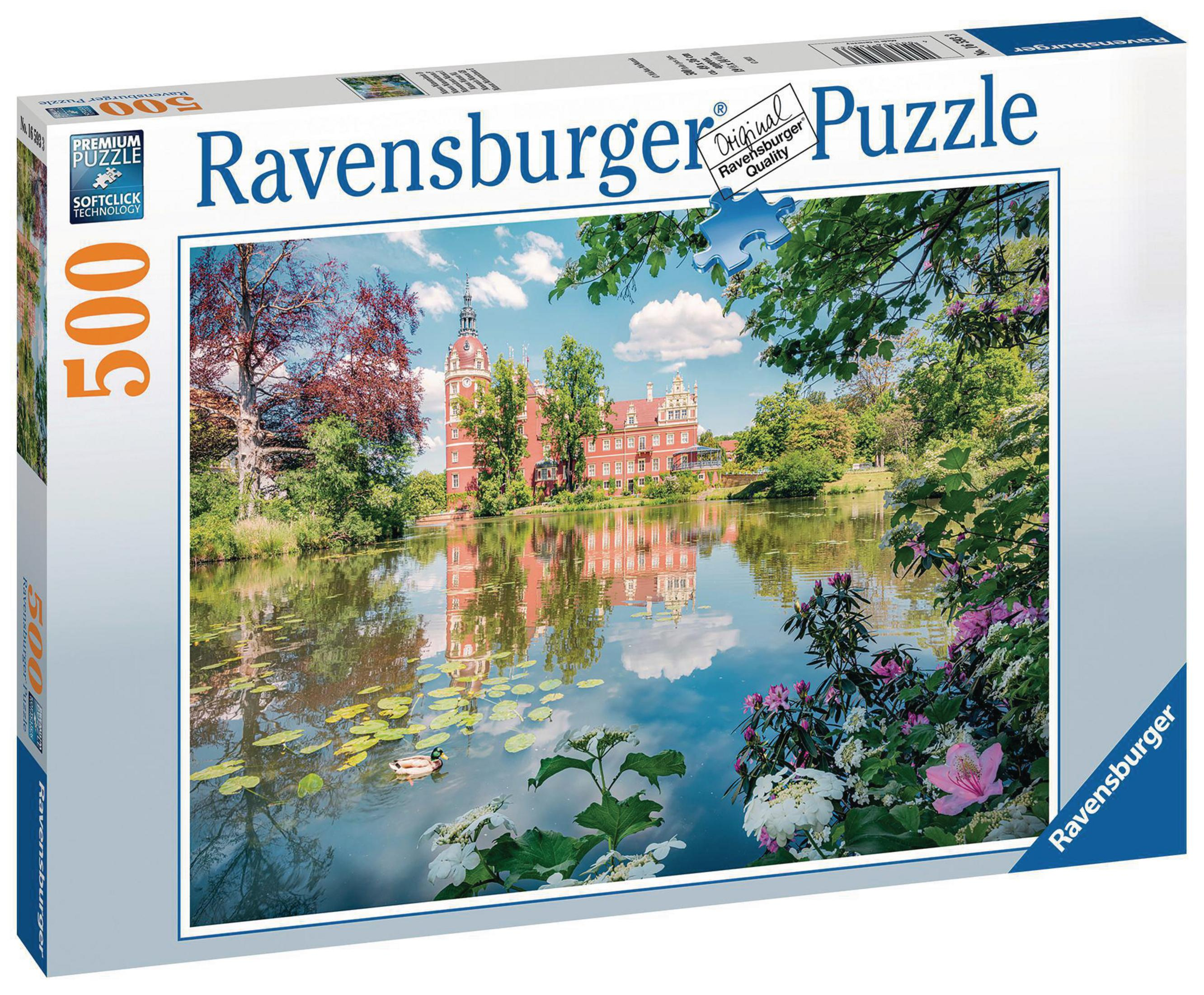 Puzzledose mit einem Bild eines Schlosses, das sich in einem See spiegelt, umgeben von Bäumen.